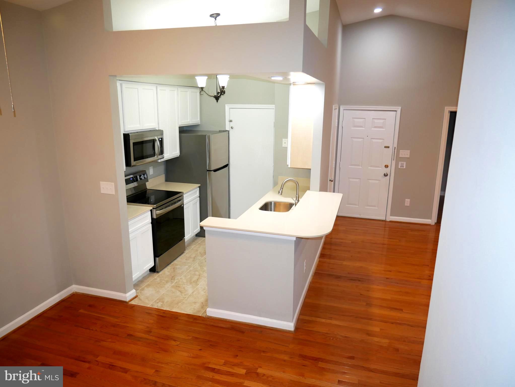 13611 Sir Thomas Way, Unit 1B33 Silver Spring, MD 20904 - Photo 3 of 26 Breakfast Bar + Dining Room