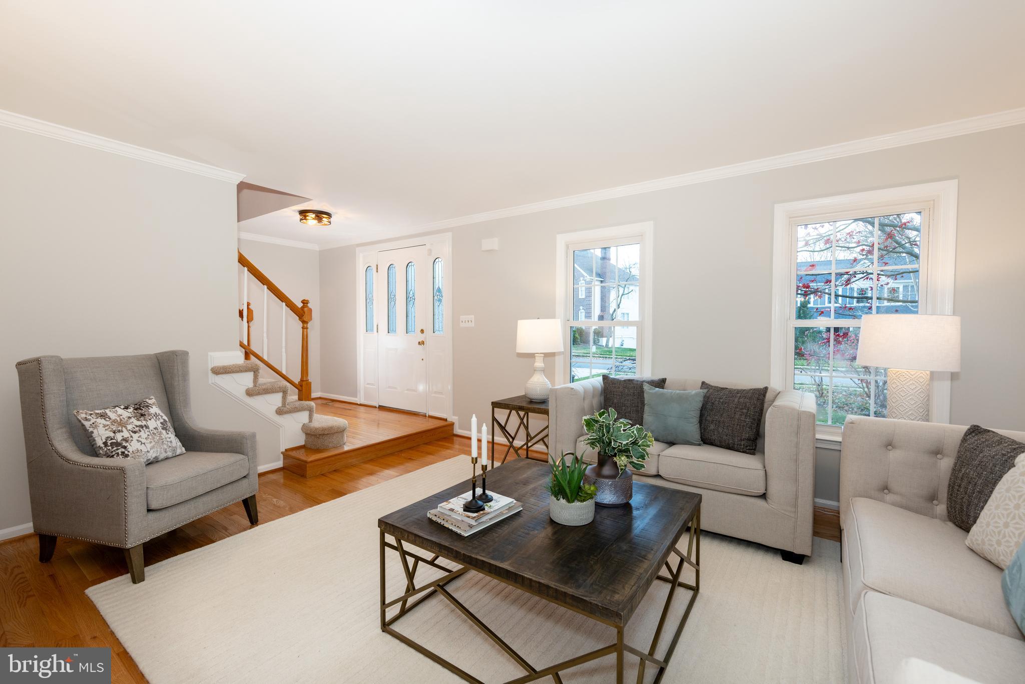 9596 Oakington Drive Fairfax Station, VA 22039 - Photo 10 of 52 a living room with furniture and a potted plant