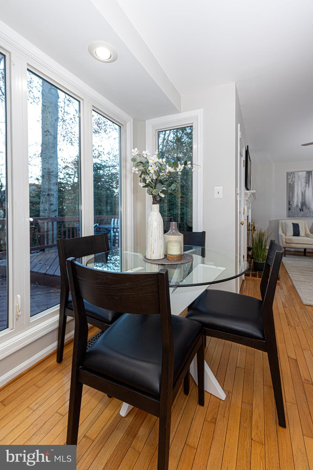 9596 Oakington Drive Fairfax Station, VA 22039 - Photo 16 of 52 a view of a dining room with furniture and wooden floor