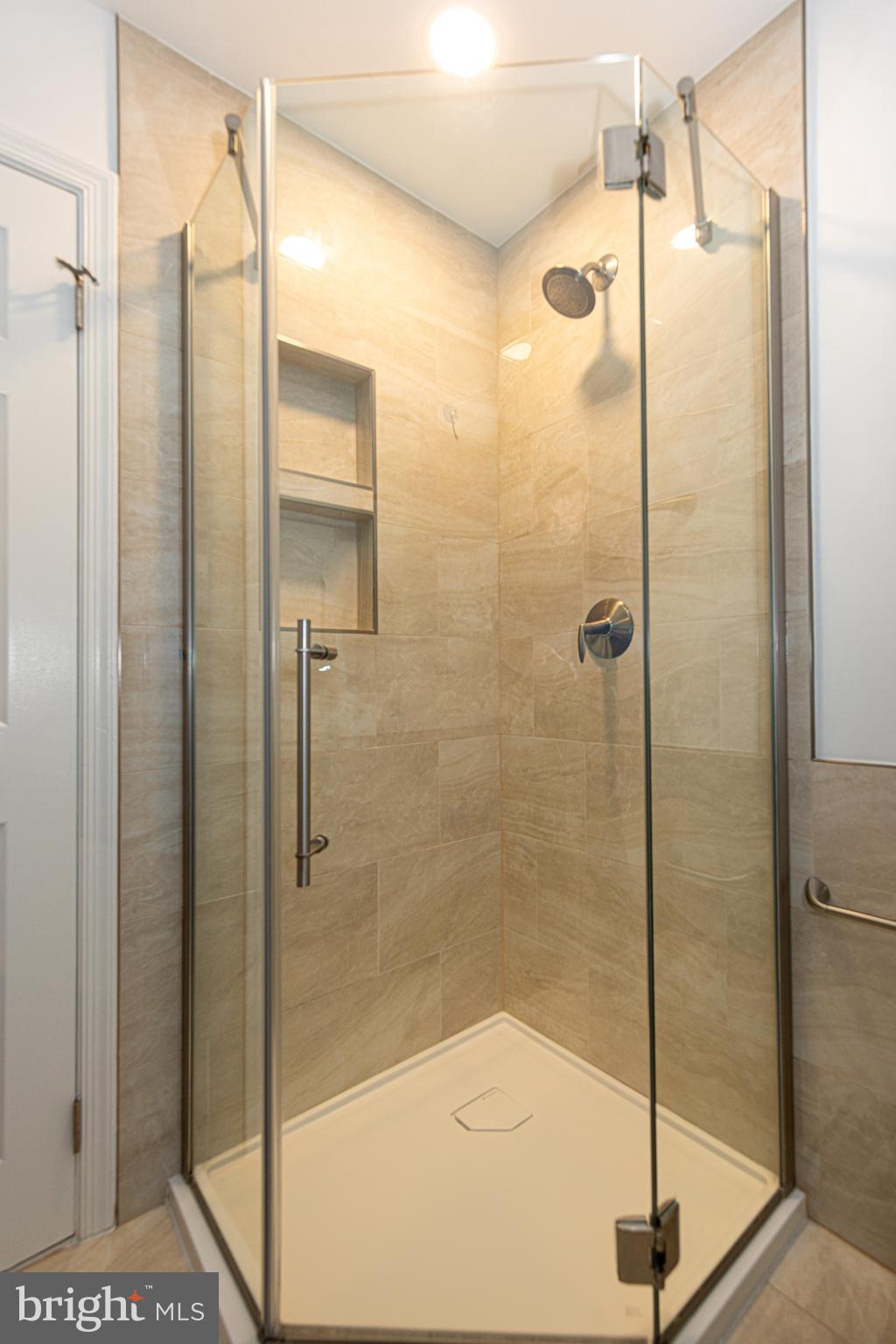 9596 Oakington Drive Fairfax Station, VA 22039 - Photo 23 of 52 a bathroom with a shower