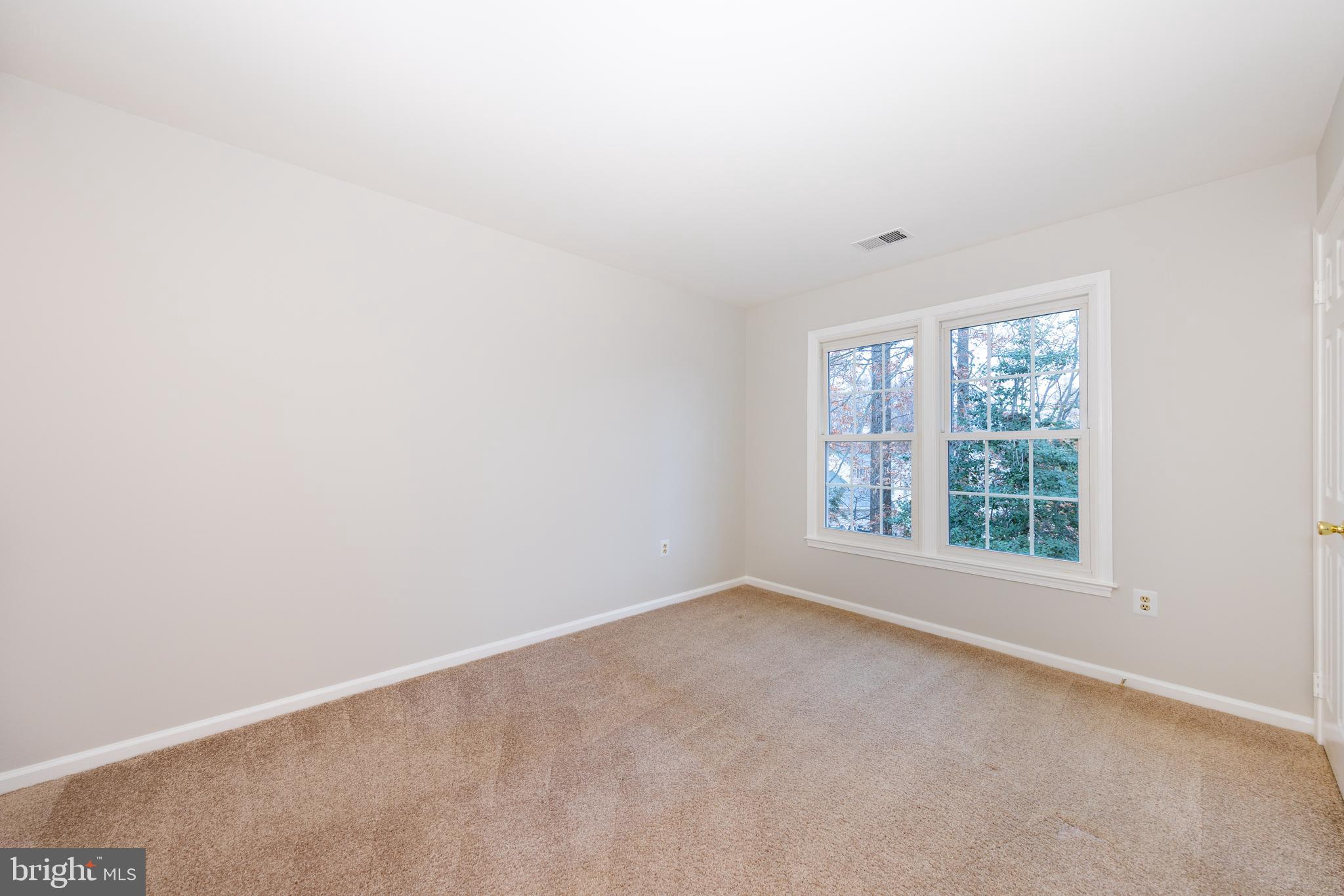 9596 Oakington Drive Fairfax Station, VA 22039 - Photo 29 of 52 an empty room with a window