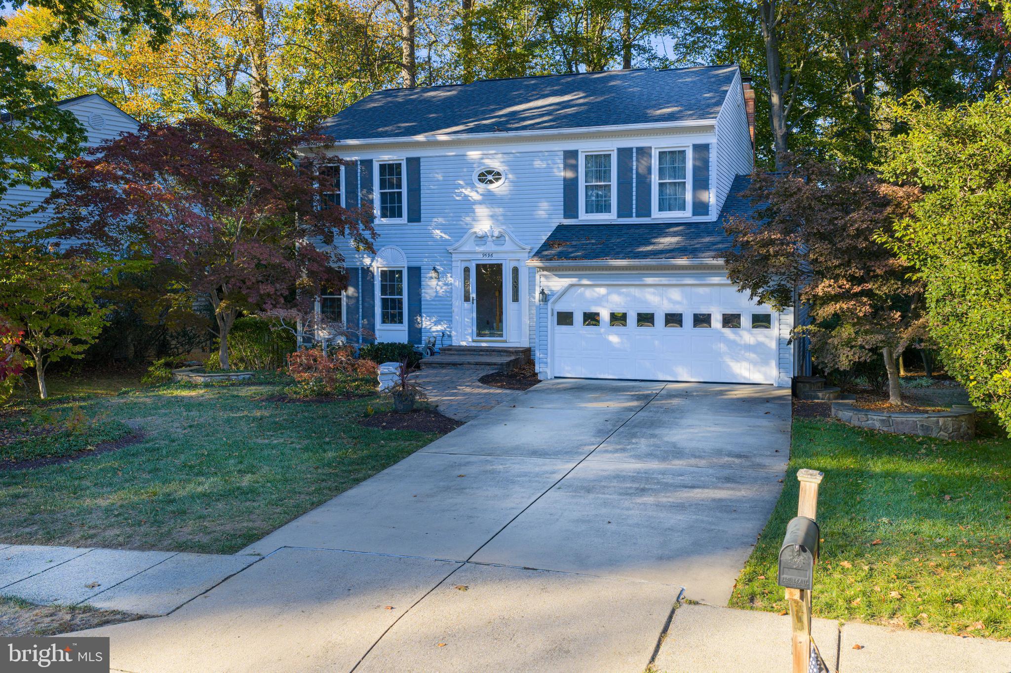 9596 Oakington Drive Fairfax Station, VA 22039 - Photo 40 of 52 a front view of house with yard and green space