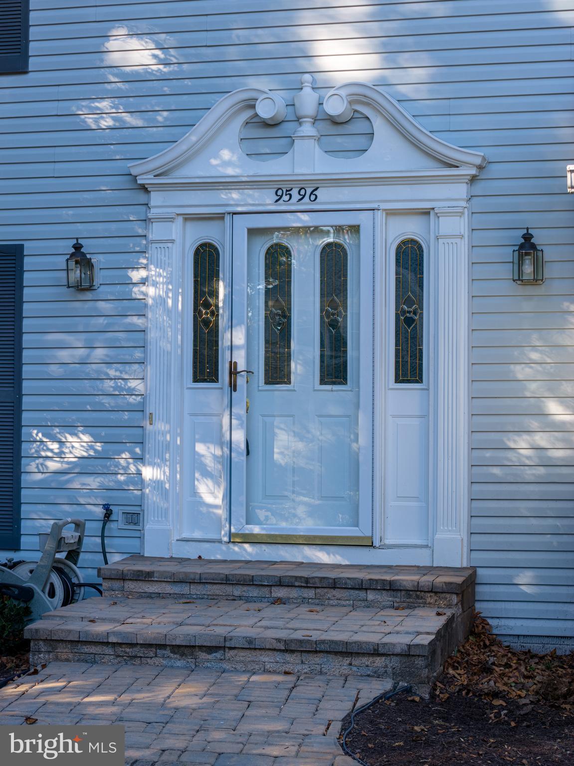 9596 Oakington Drive Fairfax Station, VA 22039 - Photo 41 of 52 a view of a brick house with two windows