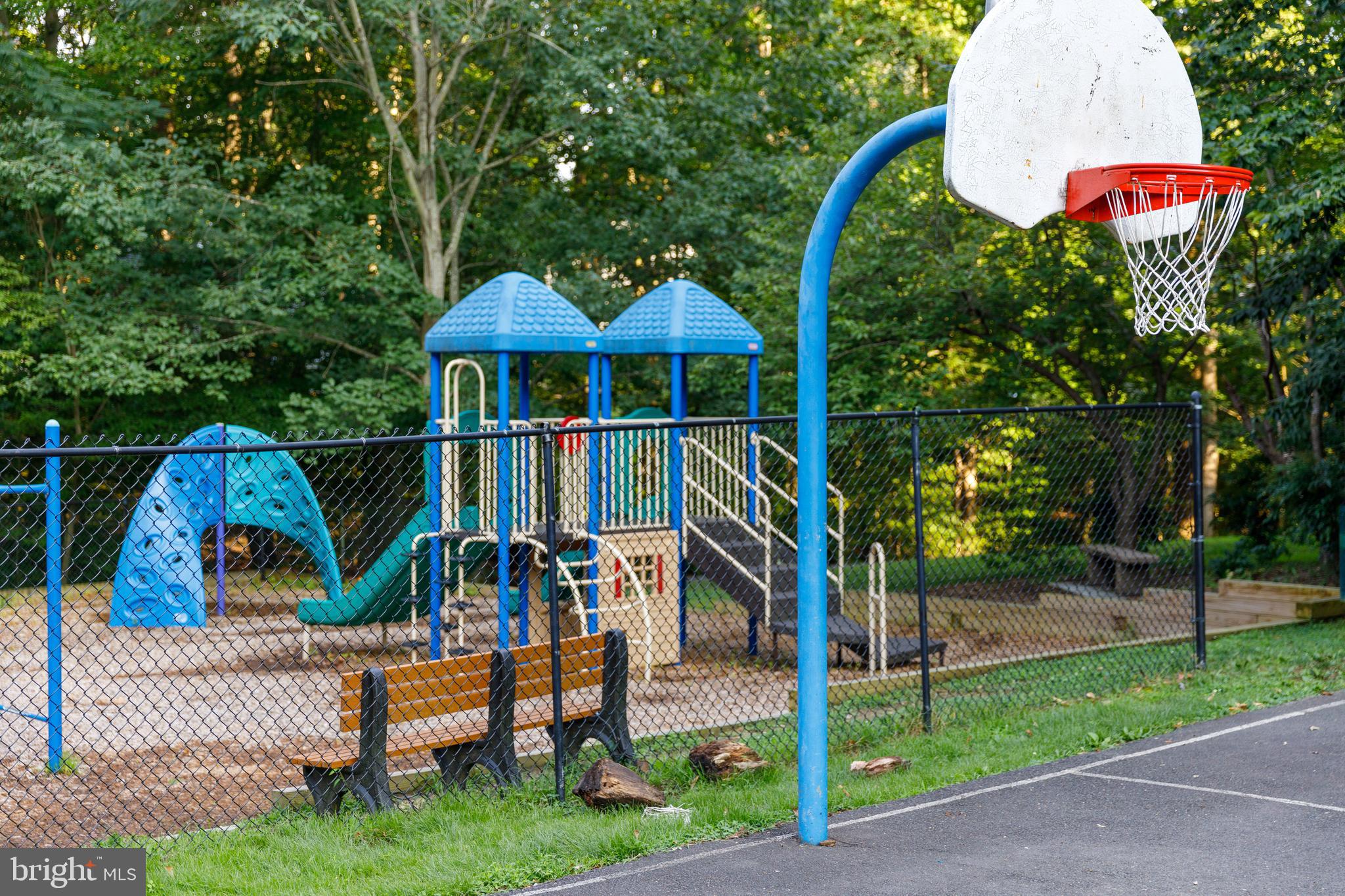 9596 Oakington Drive Fairfax Station, VA 22039 - Photo 49 of 52 a view of a park with plants and a bench