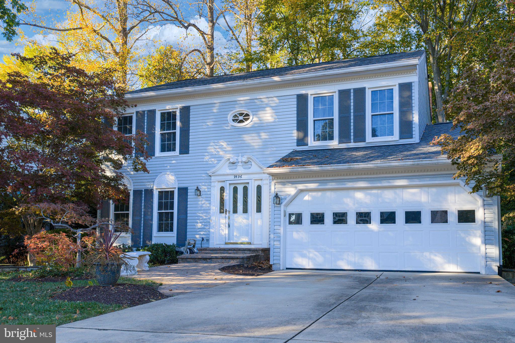 9596 Oakington Drive Fairfax Station, VA 22039 - Photo 4 of 52 a front view of a house with a yard
