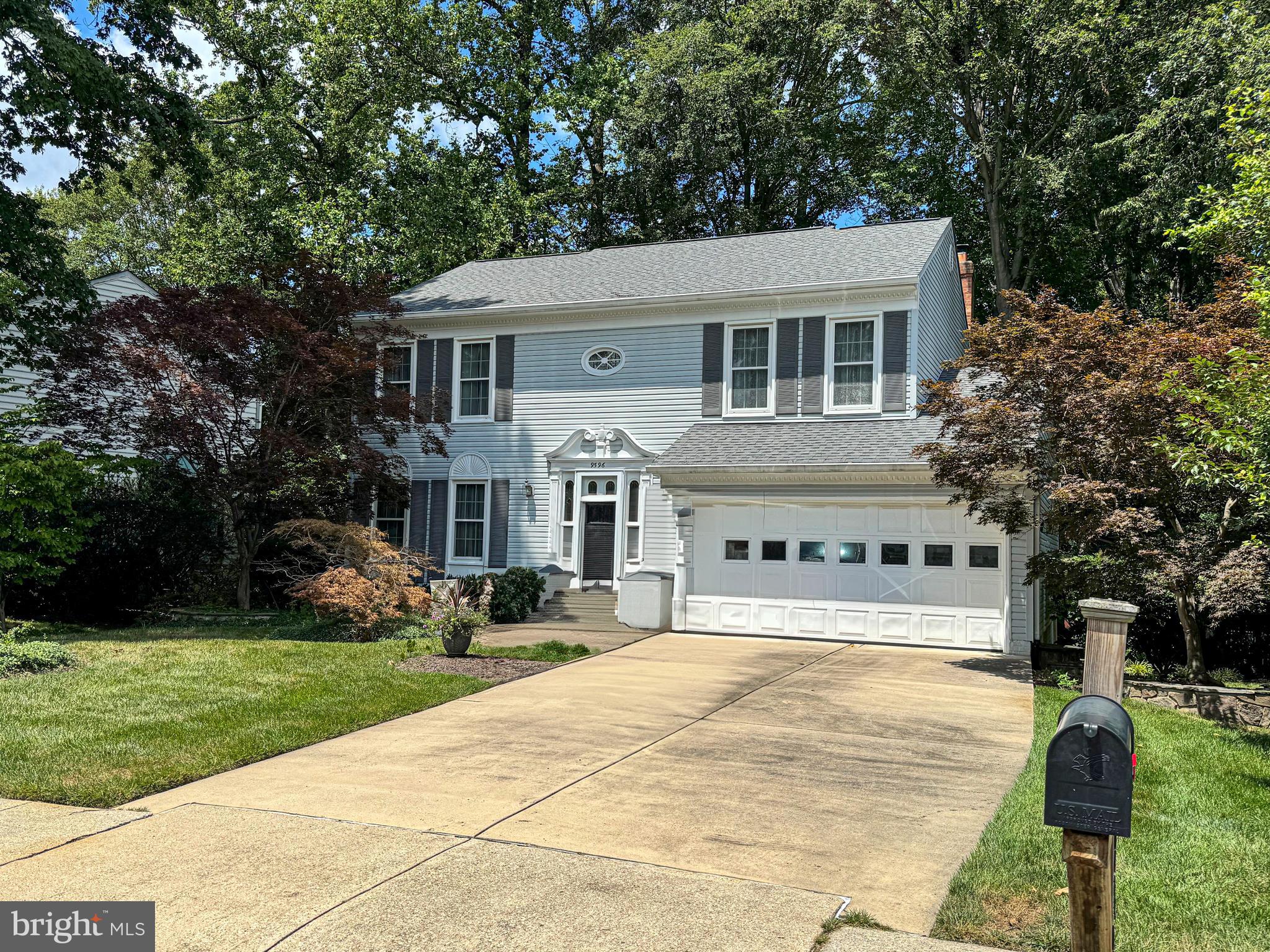9596 Oakington Drive Fairfax Station, VA 22039 - Photo 5 of 52 a house with trees in the background