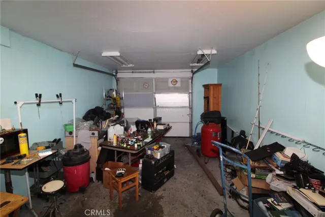 a room with gym equipment and a mirror