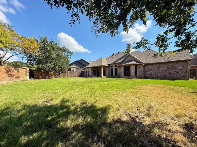 a house view with swimming pool in front of it