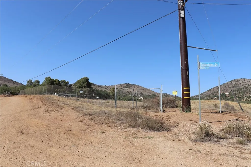 a view of a dry yard with mountain