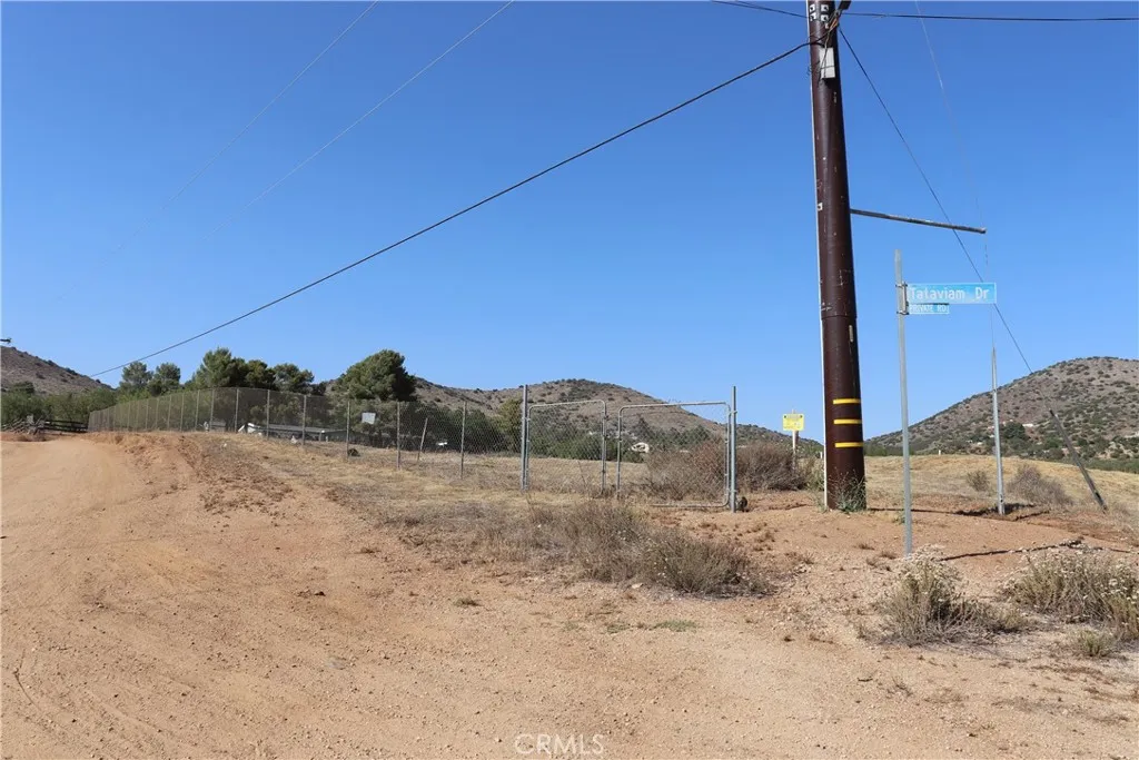 a view of a dry yard with mountain