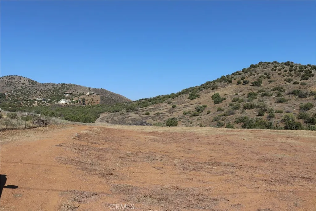 0 Hanawalt Road Santa Clarita, CA 91350 - Photo 13 of 18 a view of a field with mountains in the background