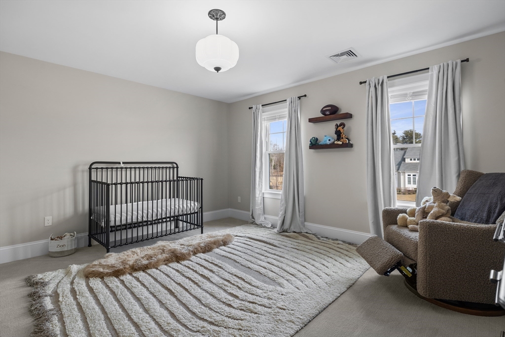 45 Rochambeau Avenue Wrentham, MA 02093 - Photo 16 of 21 a bedroom with a bed and a couch