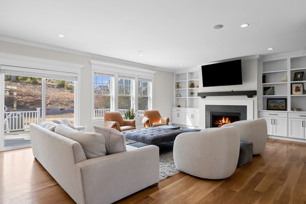 45 Rochambeau Avenue Wrentham, MA 02093 - Photo 8 of 21 a living room with fireplace furniture and a flat screen tv
