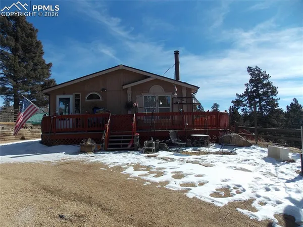 a view of house with yard covered in snow