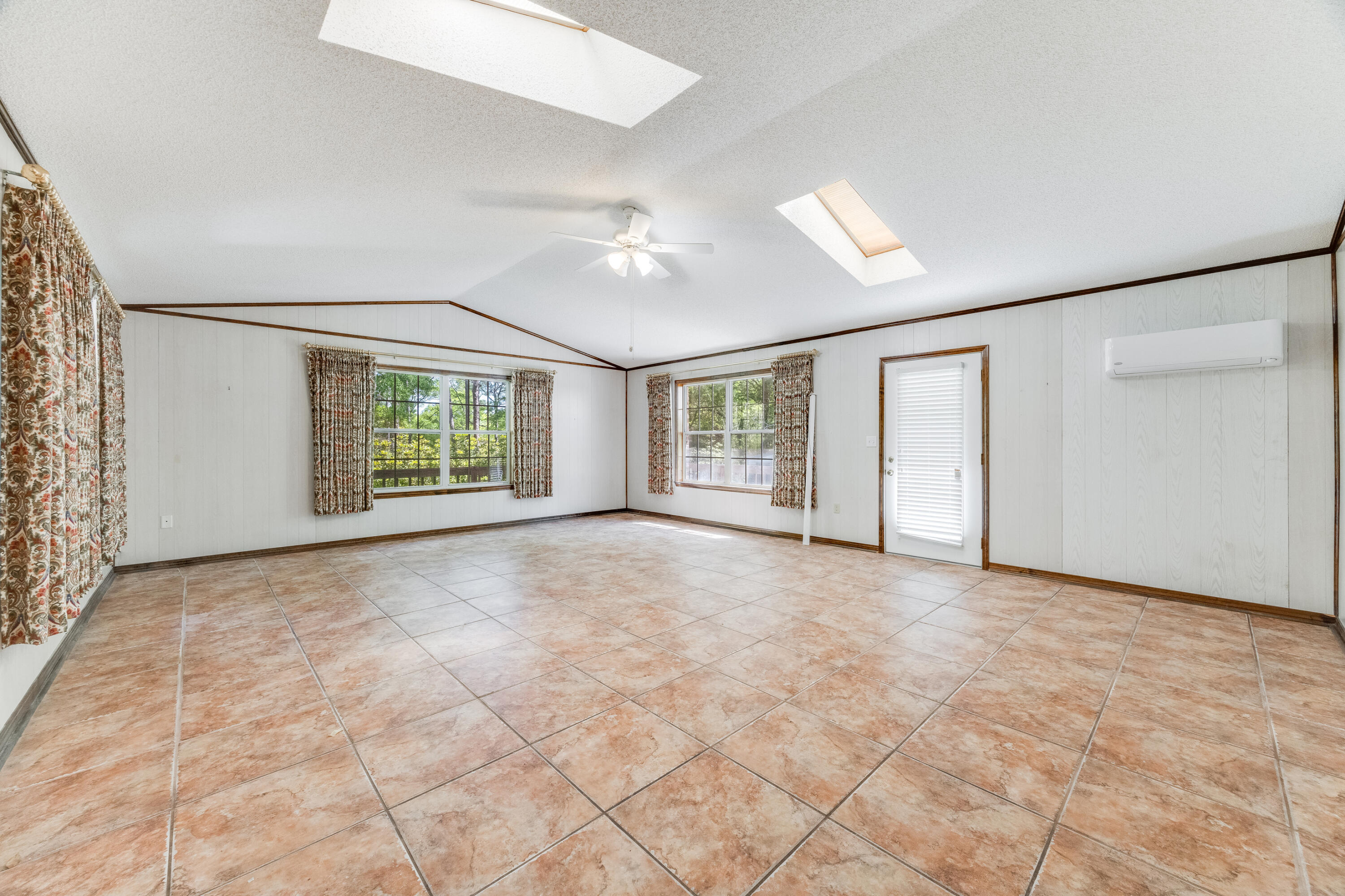 3607 Poverty Creek Road Crestview, FL 32539 - Photo 12 of 42 an empty room with windows and closet