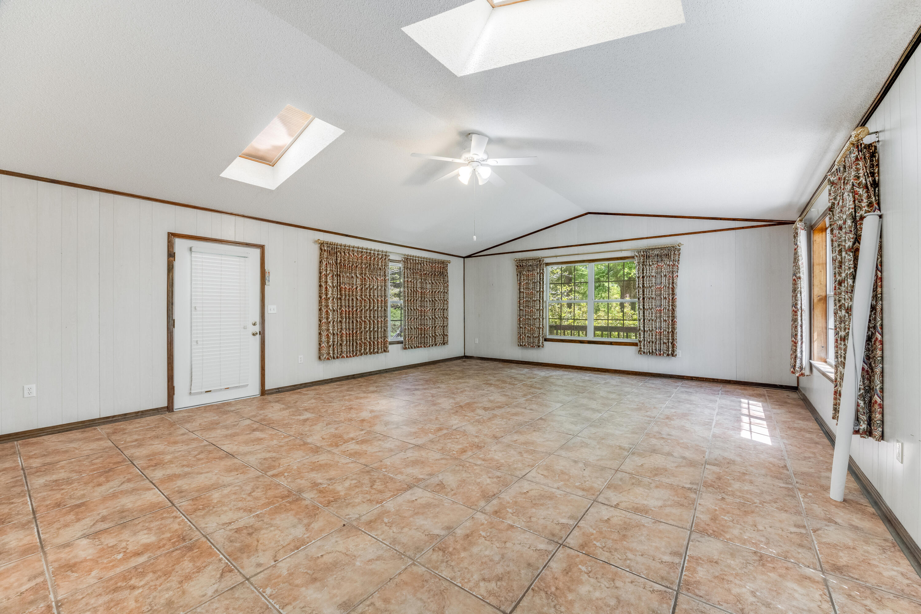 3607 Poverty Creek Road Crestview, FL 32539 - Photo 14 of 42 an empty room with windows and closet