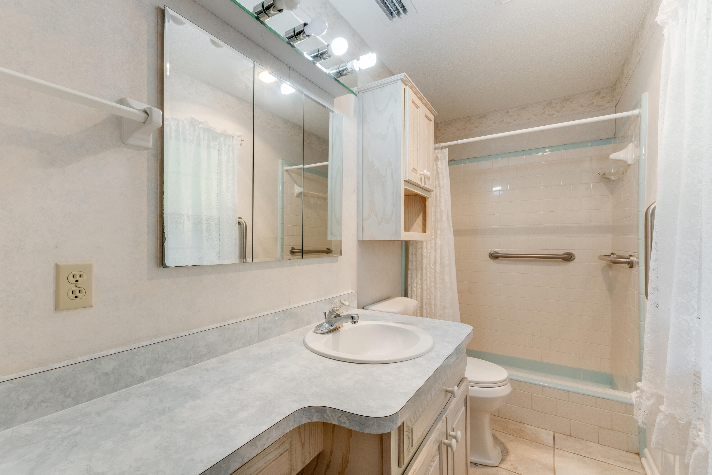3607 Poverty Creek Road Crestview, FL 32539 - Photo 16 of 42 a bathroom with a sink and a mirror