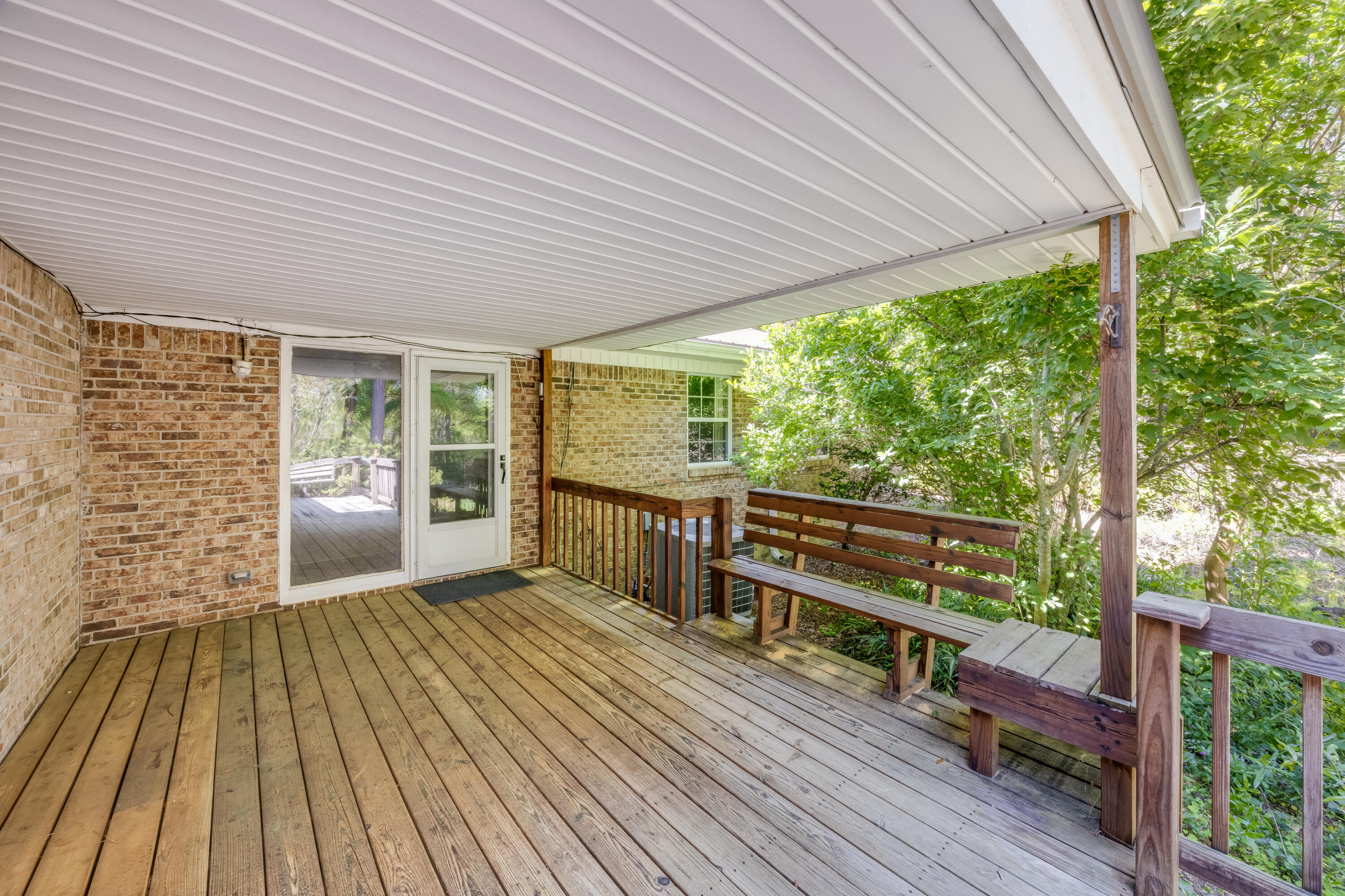 3607 Poverty Creek Road Crestview, FL 32539 - Photo 26 of 42 a view of a patio with wooden floor