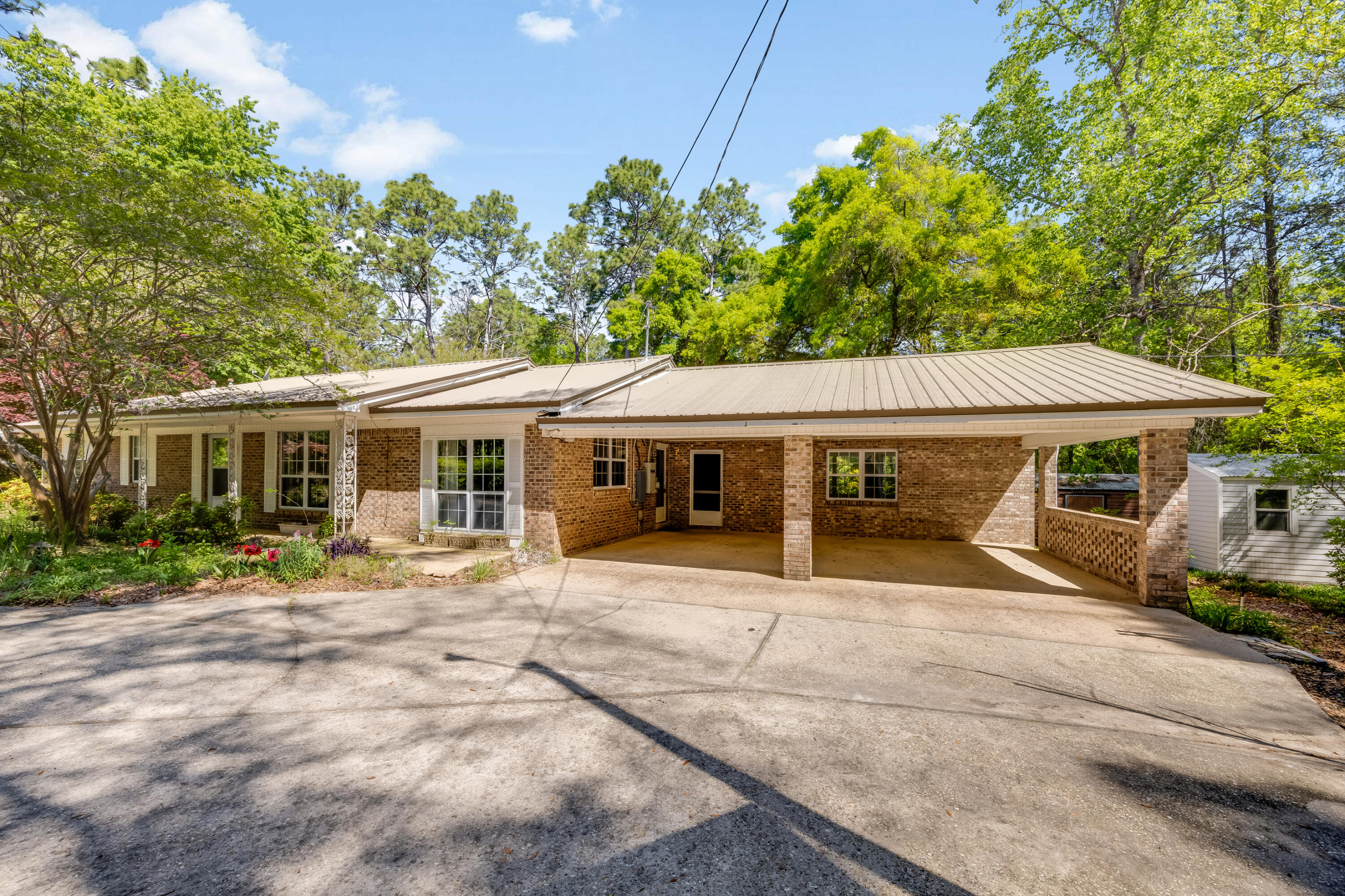 3607 Poverty Creek Road Crestview, FL 32539 - Photo 5 of 42 a view of a house with a yard and sitting area