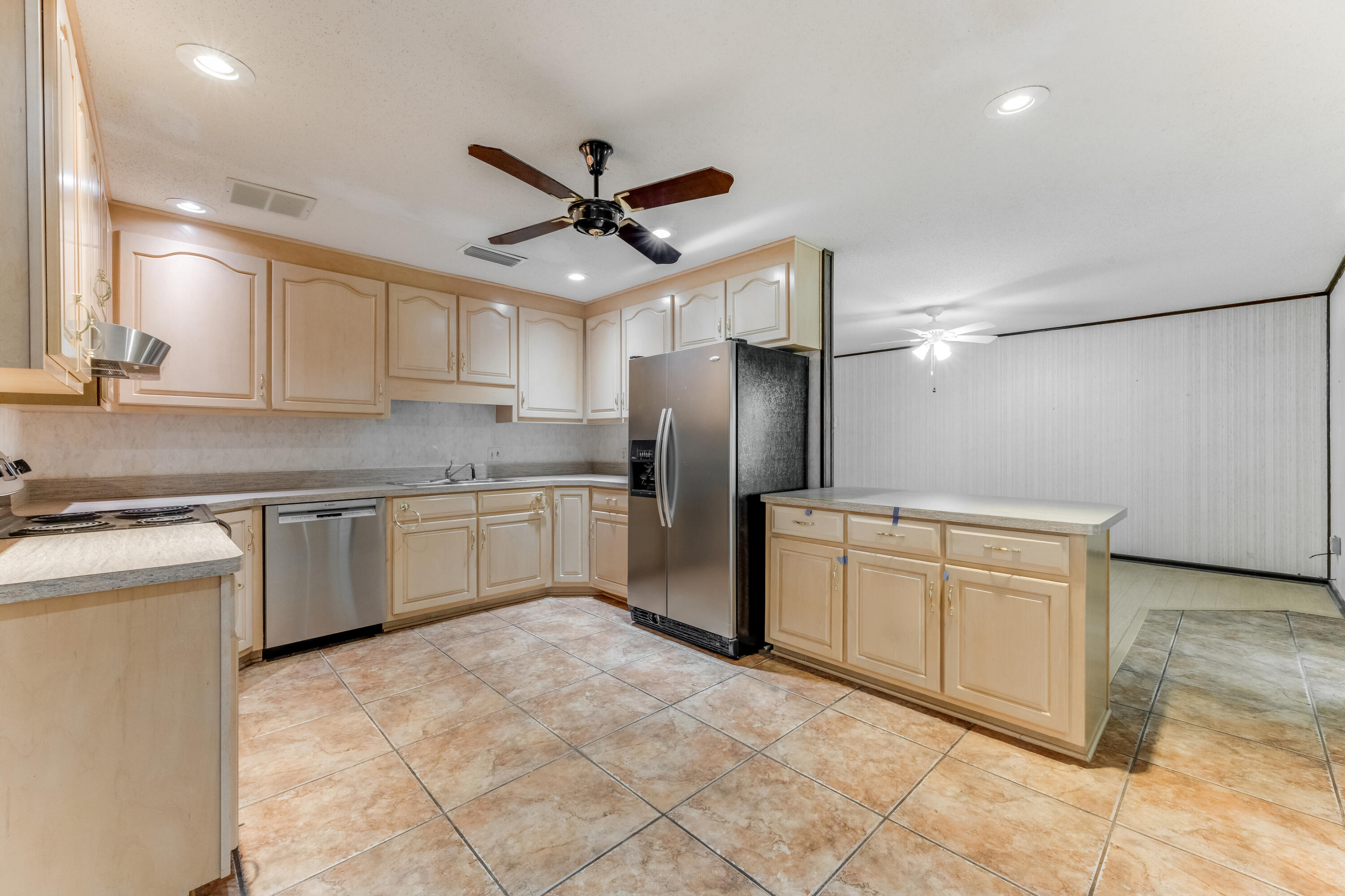 3607 Poverty Creek Road Crestview, FL 32539 - Photo 6 of 42 a kitchen with cabinets stainless steel appliances and a counter top space