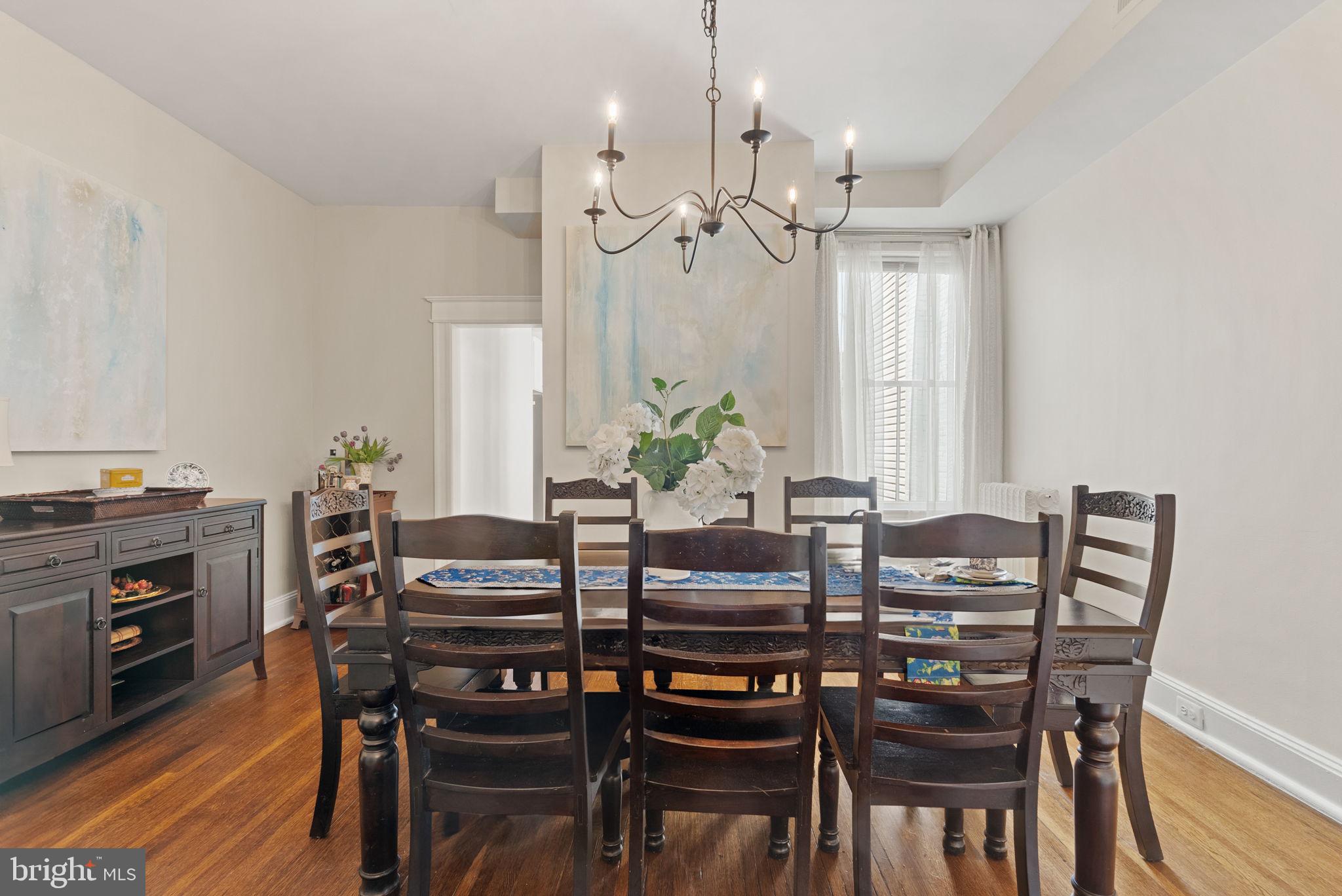 1716 Euclid Street Northwest Washington, DC 20009 - Photo 11 of 54 a view of a dining room with furniture and wooden floor