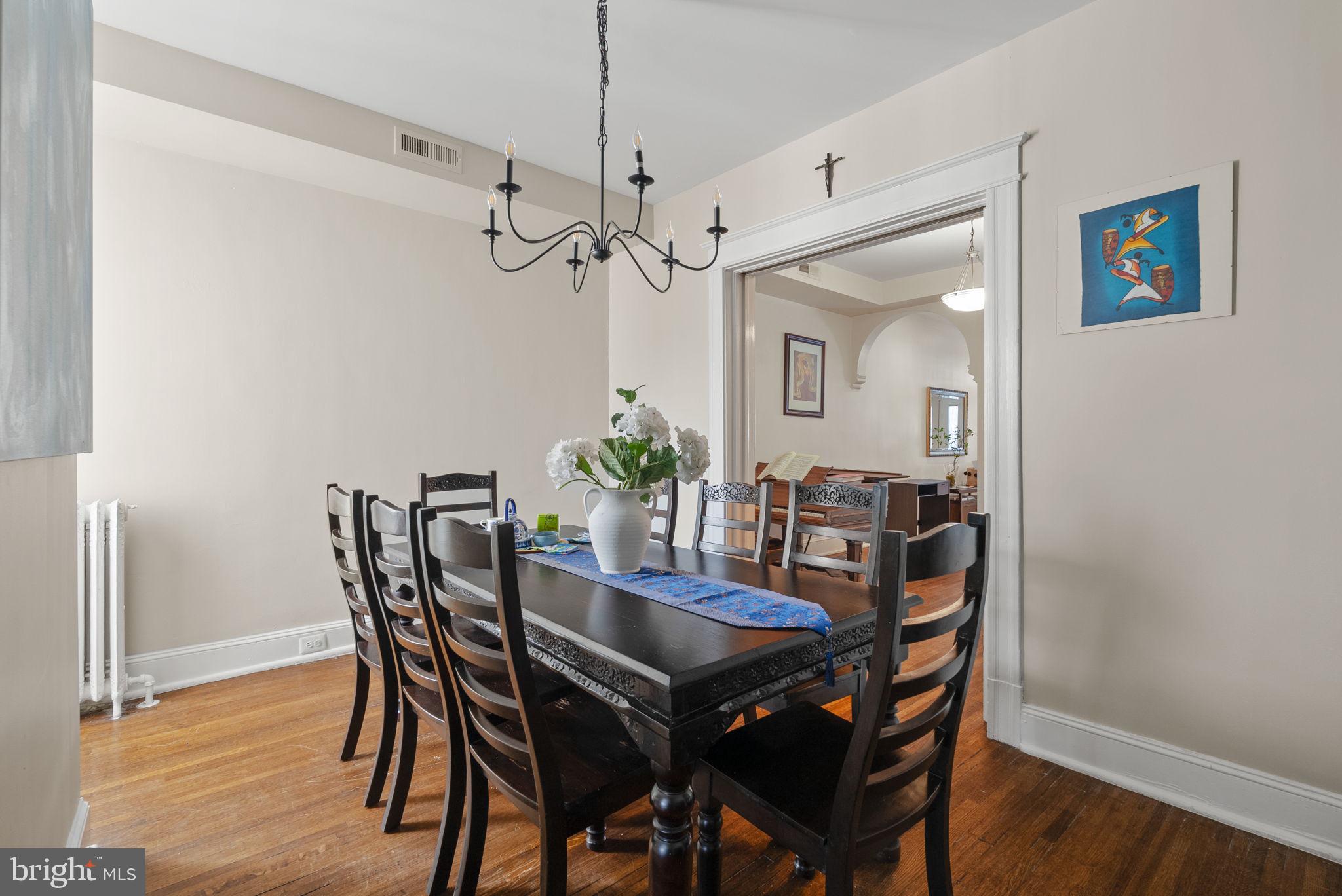 1716 Euclid Street Northwest Washington, DC 20009 - Photo 13 of 54 a view of a dining room with furniture and wooden floor