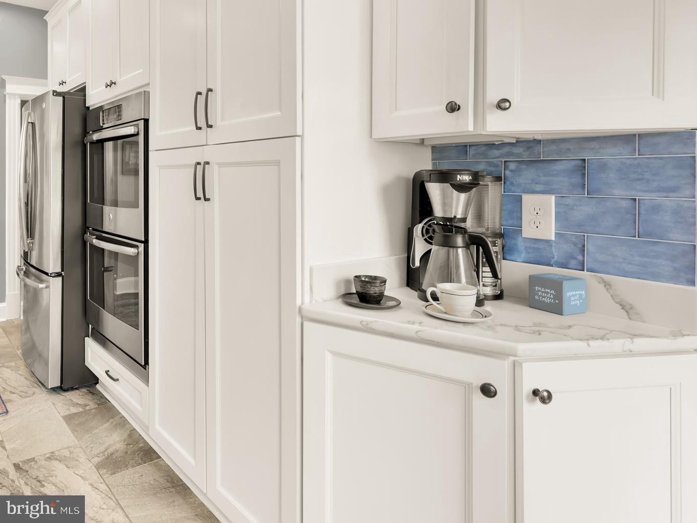 1716 Euclid Street Northwest Washington, DC 20009 - Photo 17 of 54 a kitchen with stainless steel appliances granite countertop a sink and refrigerator