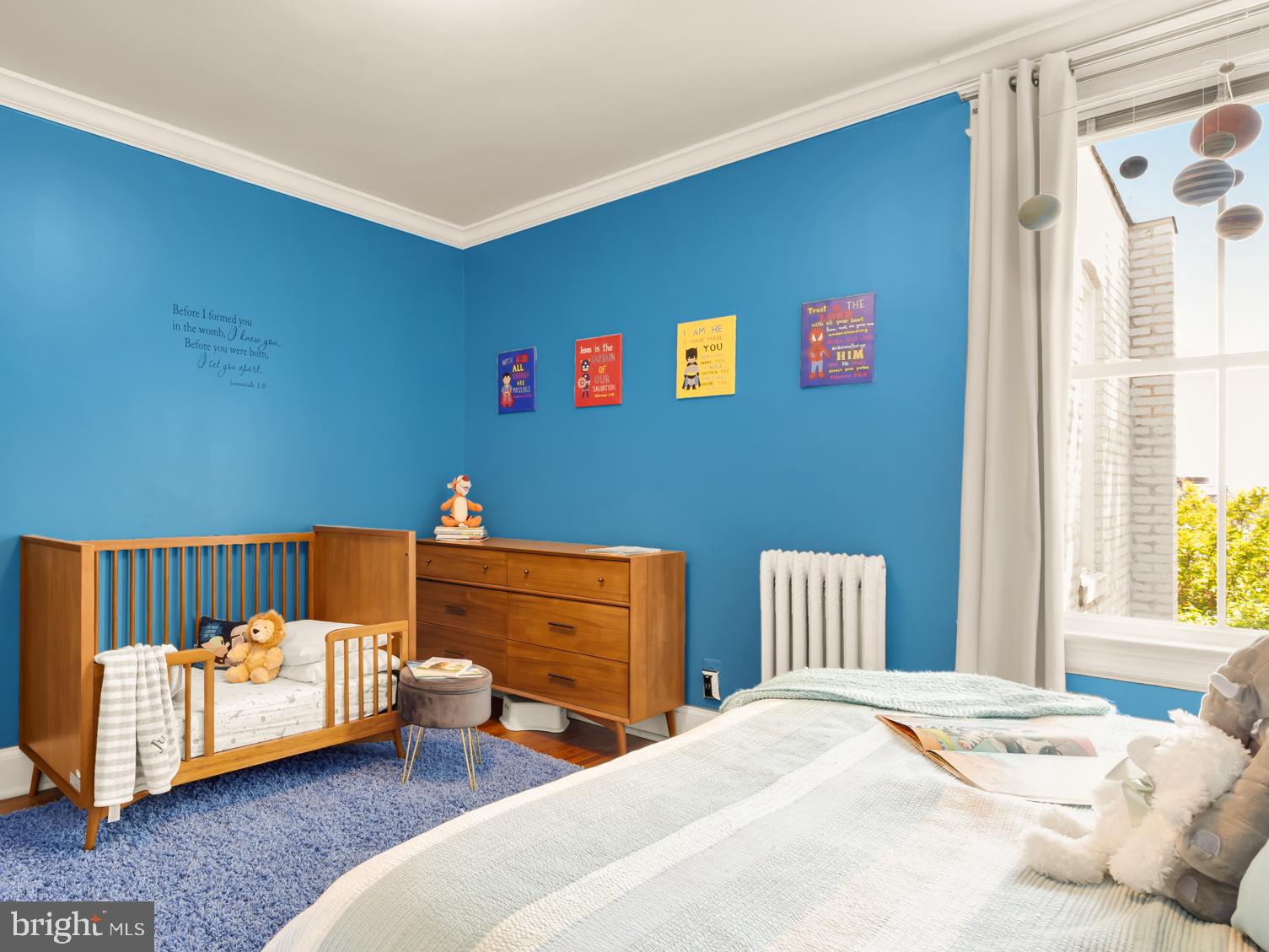 1716 Euclid Street Northwest Washington, DC 20009 - Photo 28 of 54 a bedroom with furniture and a window