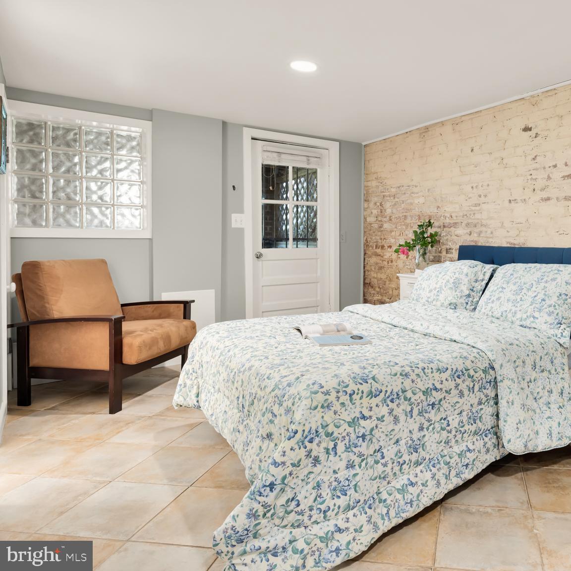 1716 Euclid Street Northwest Washington, DC 20009 - Photo 38 of 54 a bedroom with a bed and window