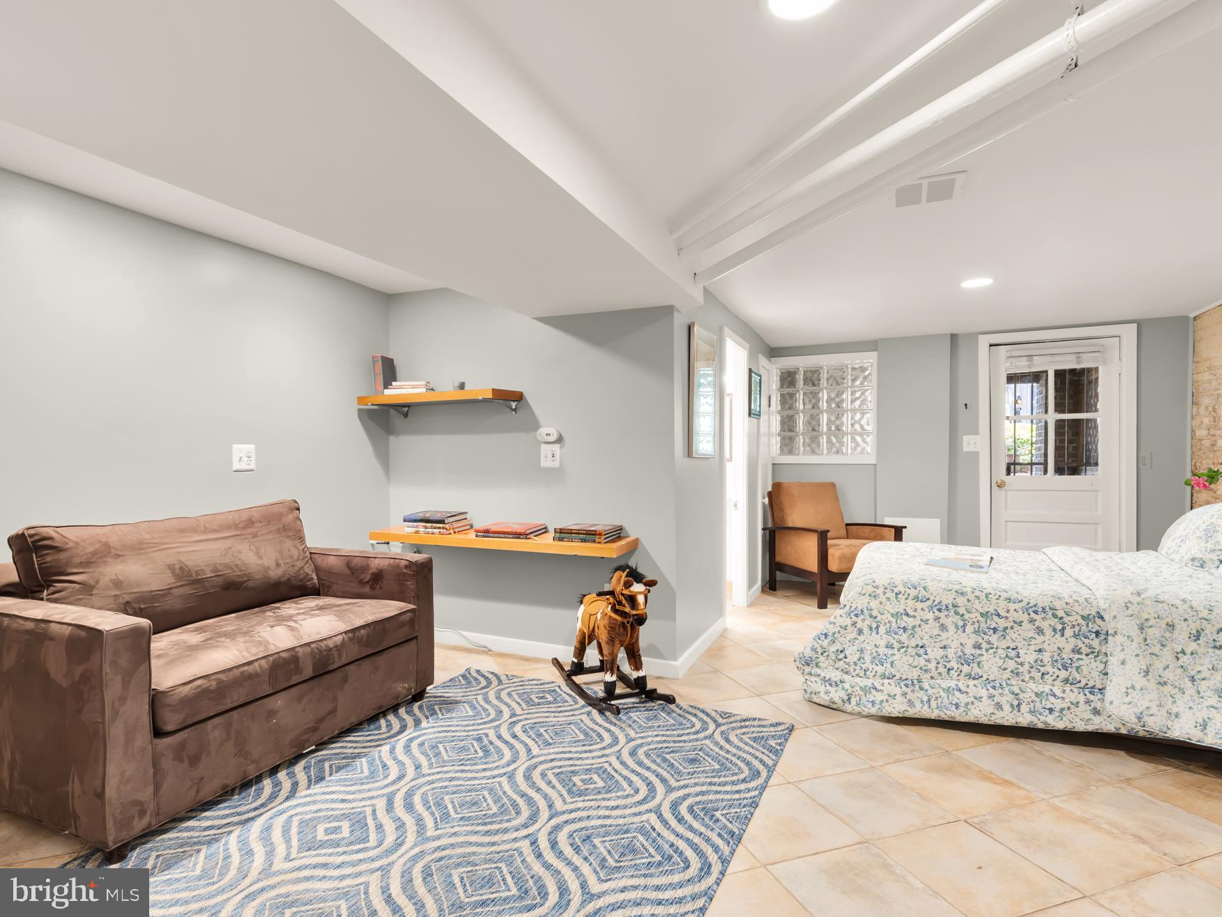1716 Euclid Street Northwest Washington, DC 20009 - Photo 39 of 54 a bedroom with furniture and a couch