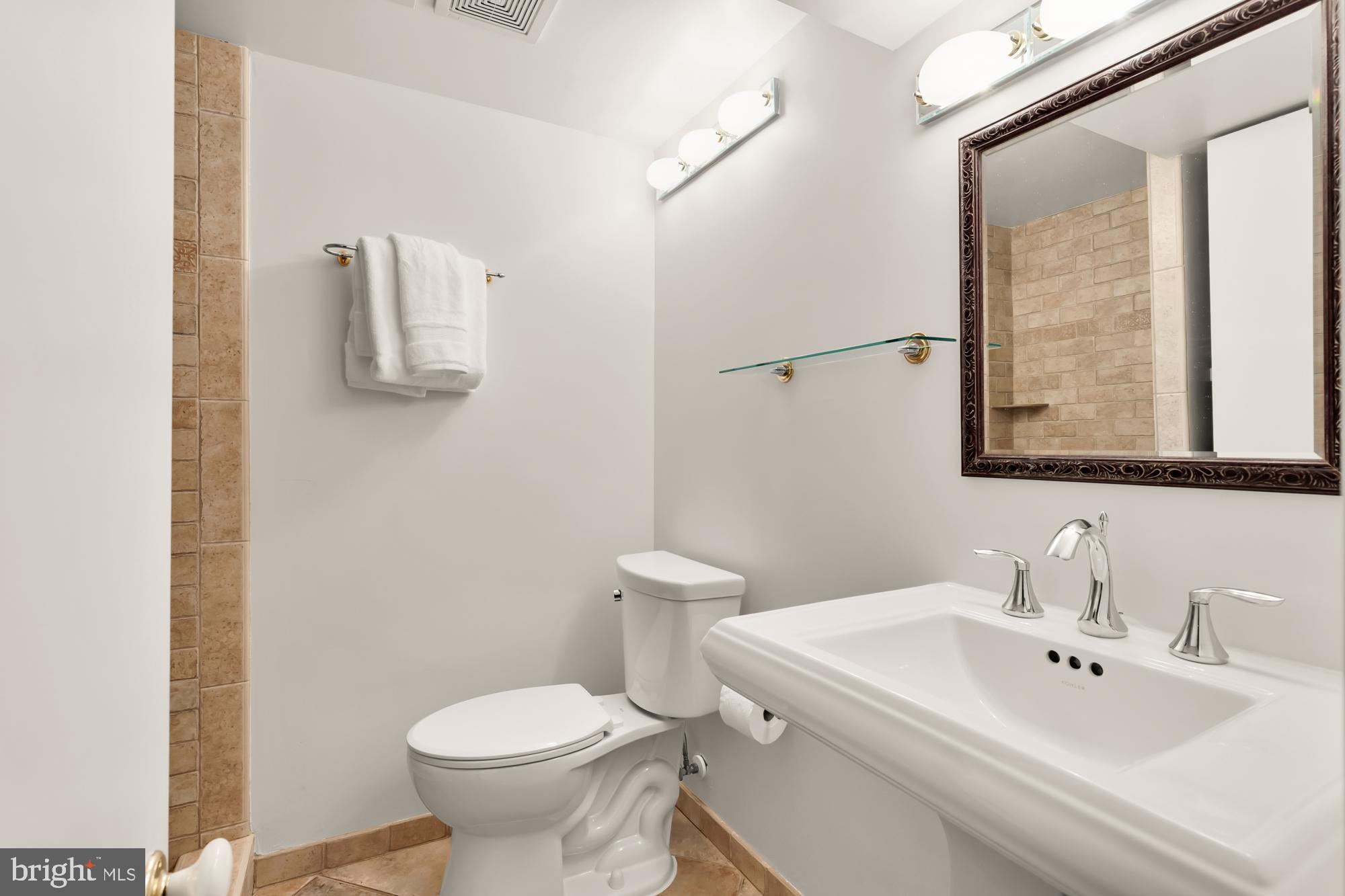 1716 Euclid Street Northwest Washington, DC 20009 - Photo 40 of 54 a bathroom with a sink toilet and mirror