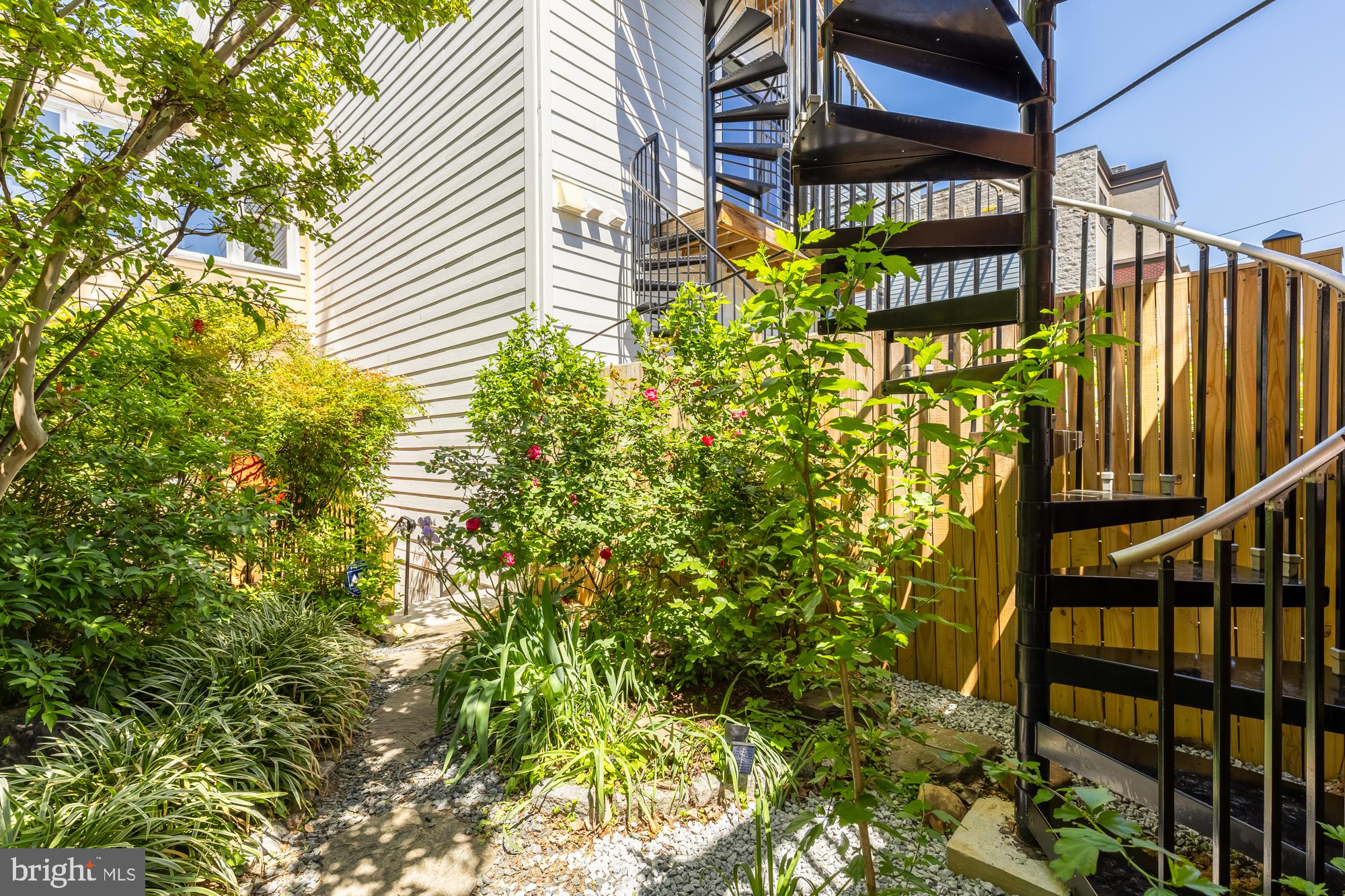1716 Euclid Street Northwest Washington, DC 20009 - Photo 48 of 54 Spiral Staircase Up to Massive Elevated Deck