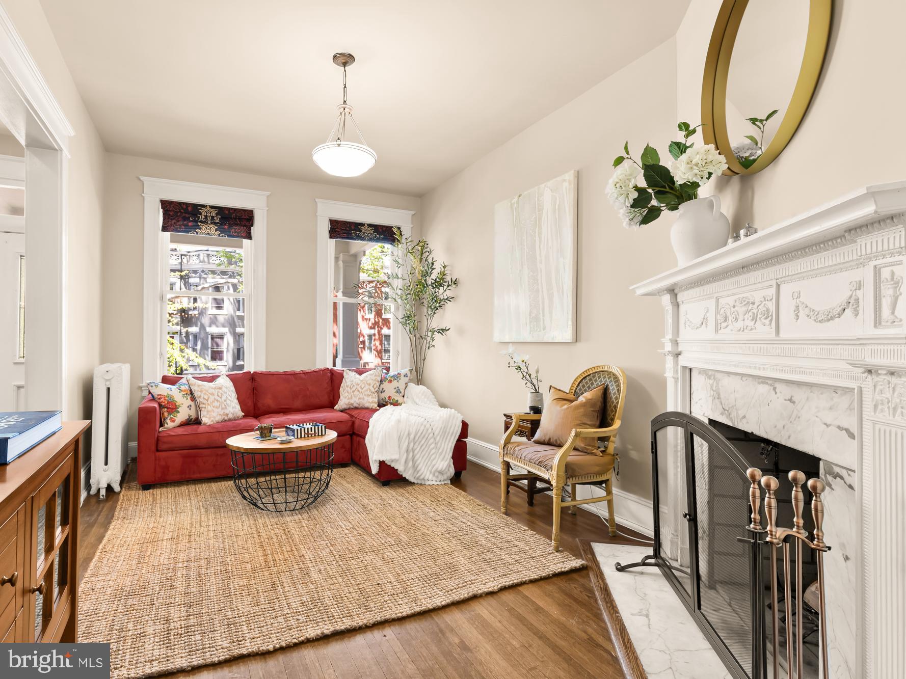 1716 Euclid Street Northwest Washington, DC 20009 - Photo 5 of 54 a living room with furniture fireplace and a large window