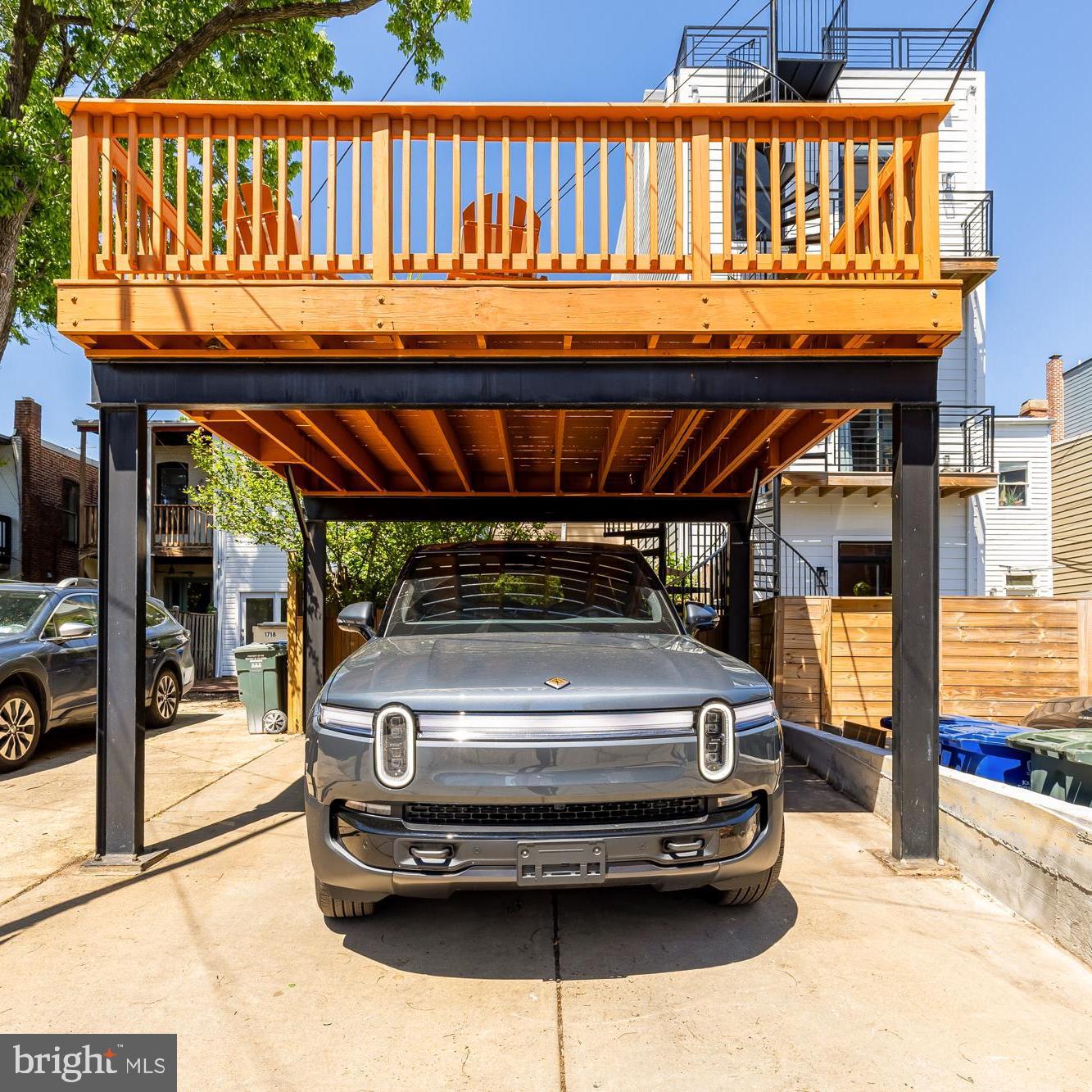 1716 Euclid Street Northwest Washington, DC 20009 - Photo 52 of 54 a view of a patio with table and chairs with wooden floor