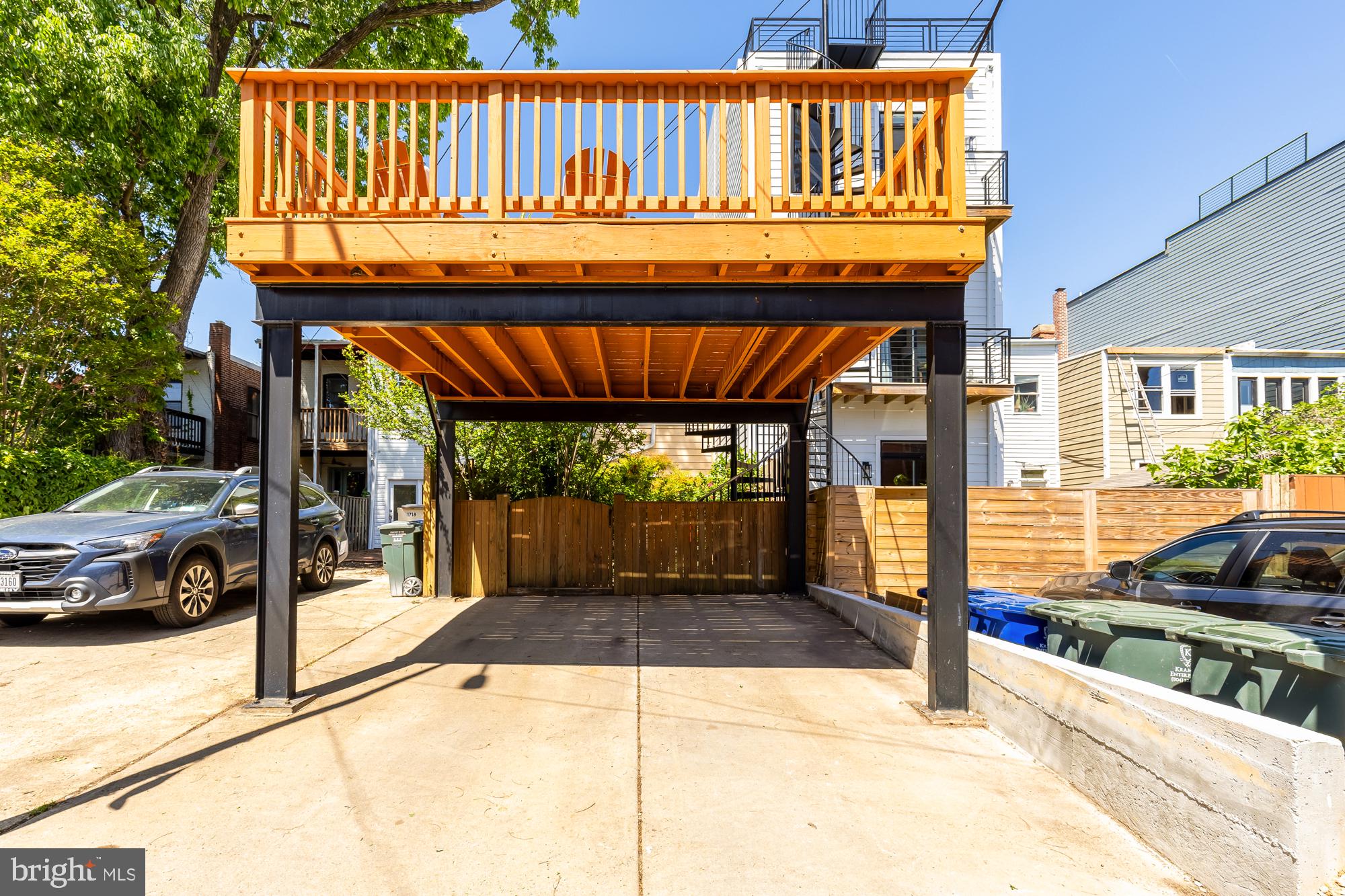 1716 Euclid Street Northwest Washington, DC 20009 - Photo 53 of 54 a view of a patio with table and chairs with wooden floor