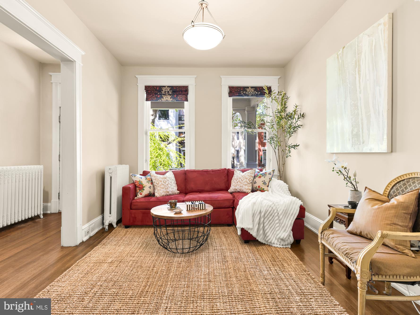 1716 Euclid Street Northwest Washington, DC 20009 - Photo 6 of 54 a living room with furniture and wooden floor