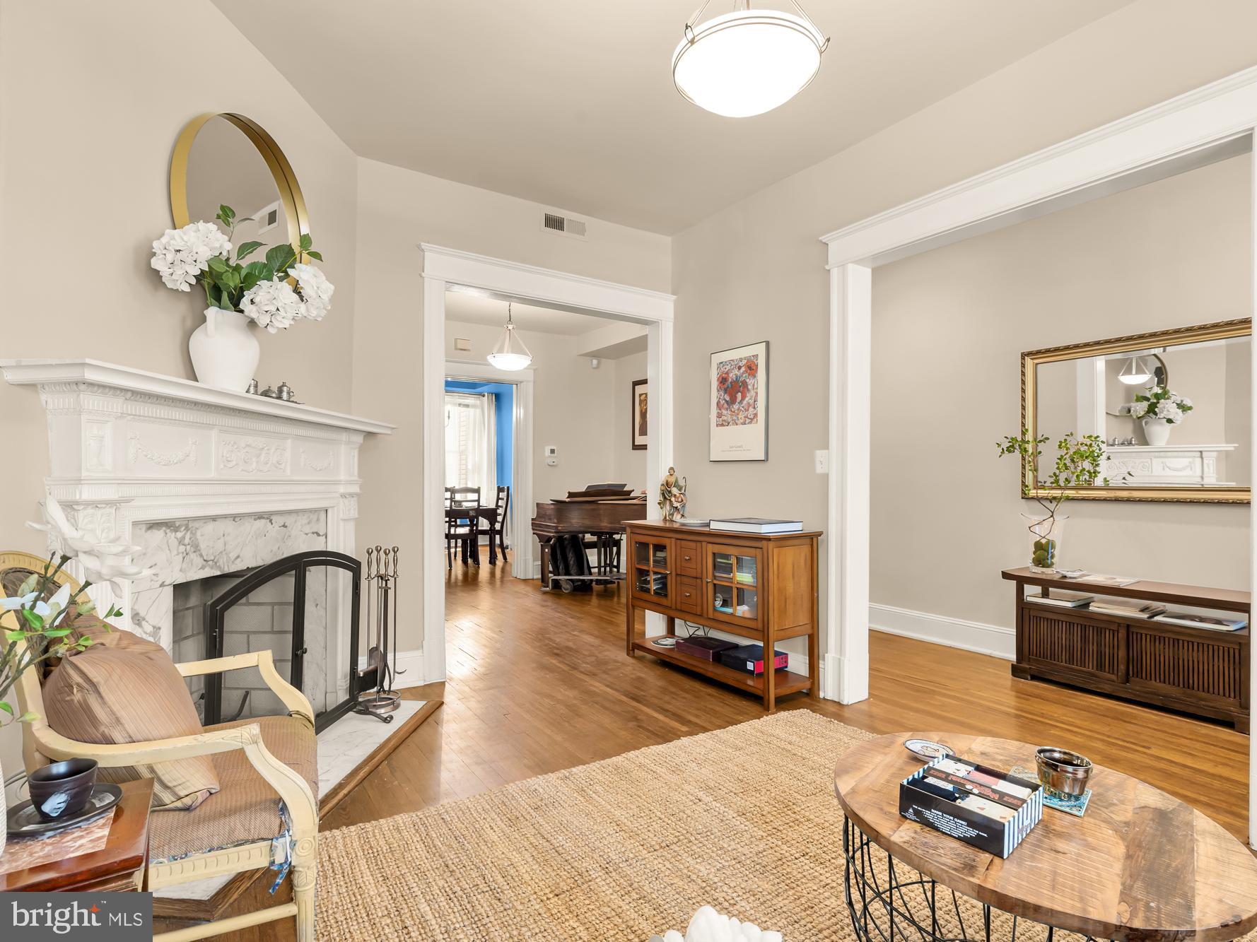 1716 Euclid Street Northwest Washington, DC 20009 - Photo 7 of 54 a living room with furniture a fireplace and a flat screen tv