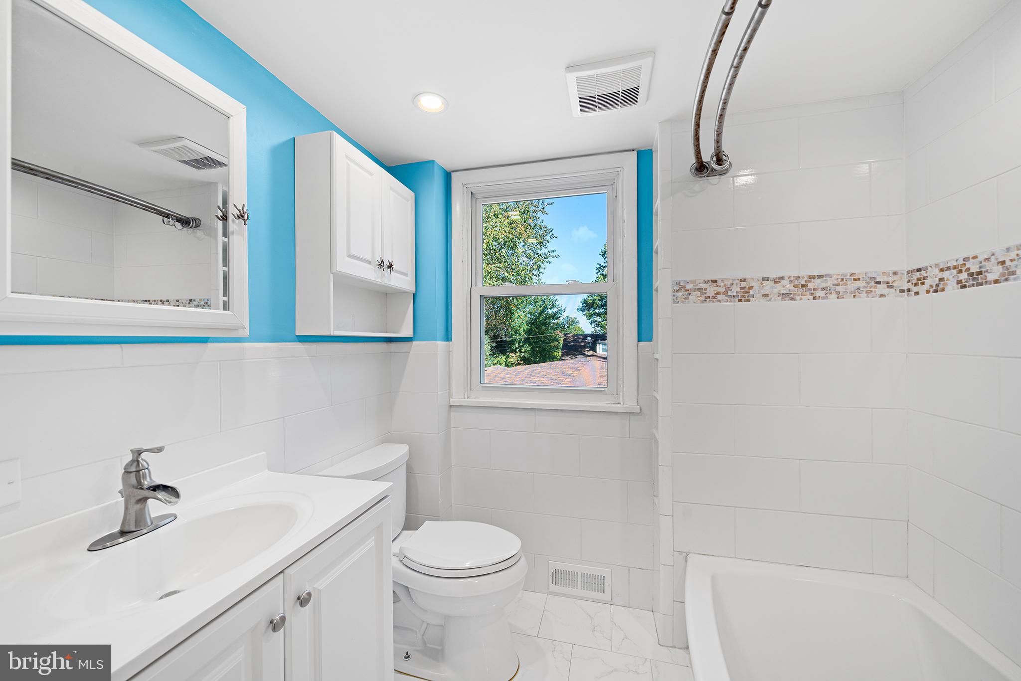 1203 Wedgewood Road Flourtown, PA 19031 - Photo 16 of 25 a bathroom with a sink a toilet and a mirror