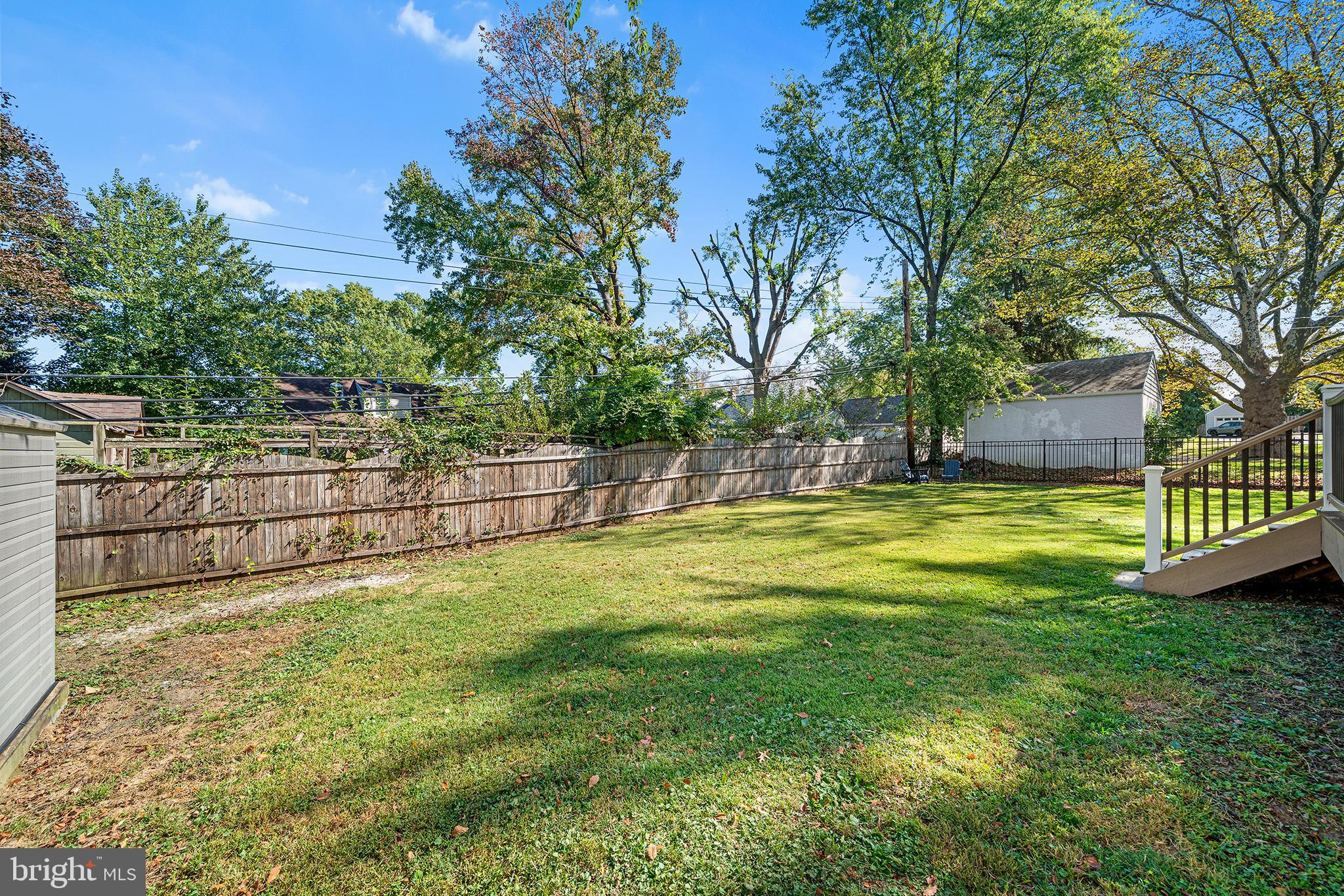 1203 Wedgewood Road Flourtown, PA 19031 - Photo 20 of 25 a view of yard with swimming pool and trees