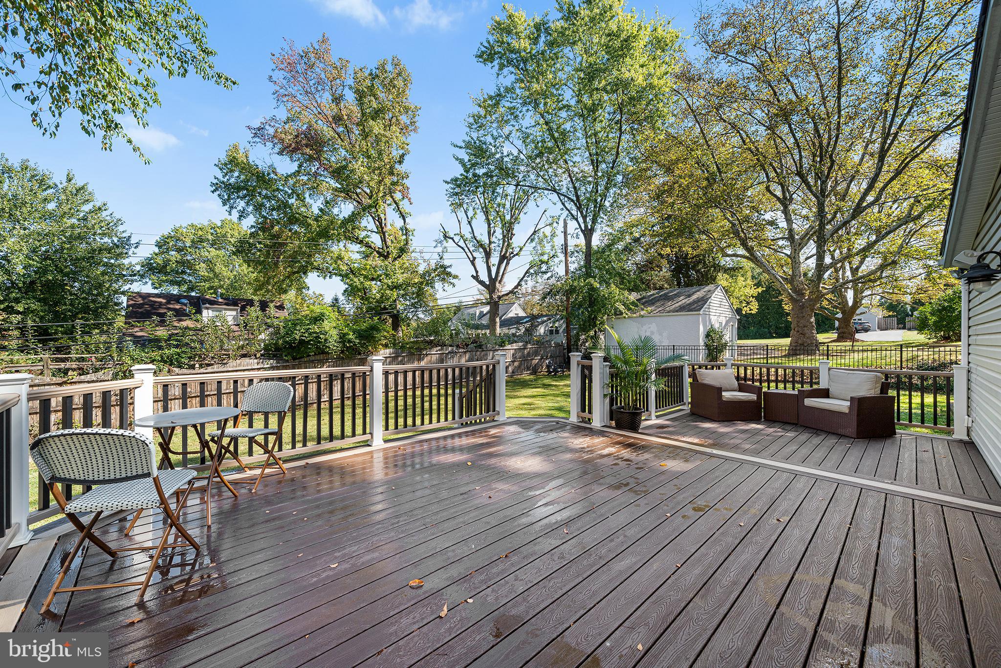 1203 Wedgewood Road Flourtown, PA 19031 - Photo 21 of 25 a view of a chair and tables on the wooden floor