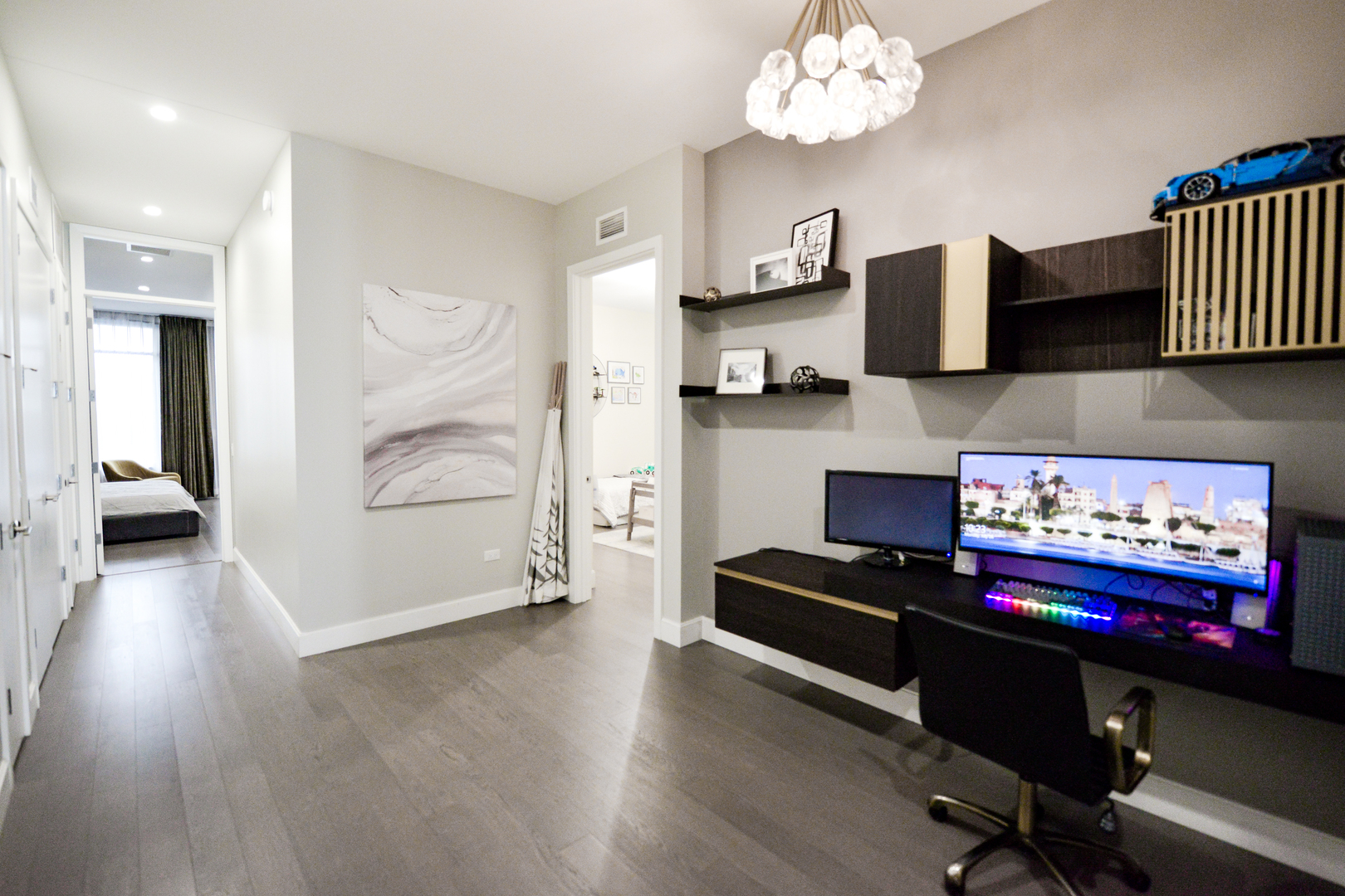 28 North Carpenter Street, Unit 2N Chicago, IL 60607 - Photo 17 of 30 a living room with furniture and a chandelier