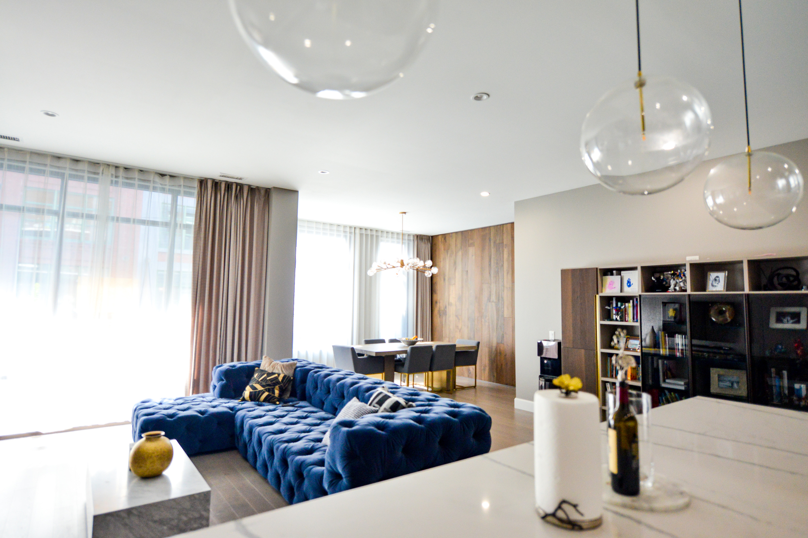 28 North Carpenter Street, Unit 2N Chicago, IL 60607 - Photo 3 of 30 a living room with furniture and a chandelier