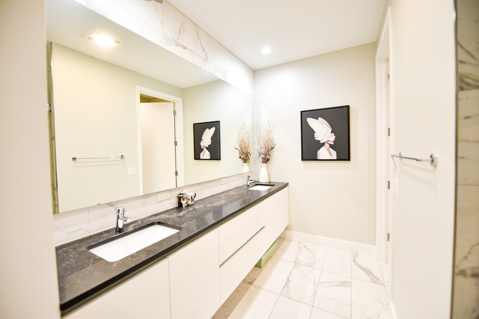28 North Carpenter Street, Unit 2N Chicago, IL 60607 - Photo 24 of 30 a bathroom with a double vanity sink and a mirror