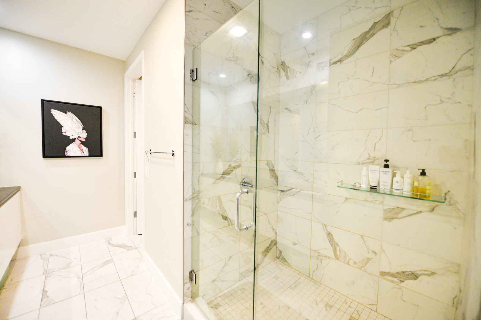 28 North Carpenter Street, Unit 2N Chicago, IL 60607 - Photo 25 of 30 a bathroom with a granite countertop sink a shower and a mirror