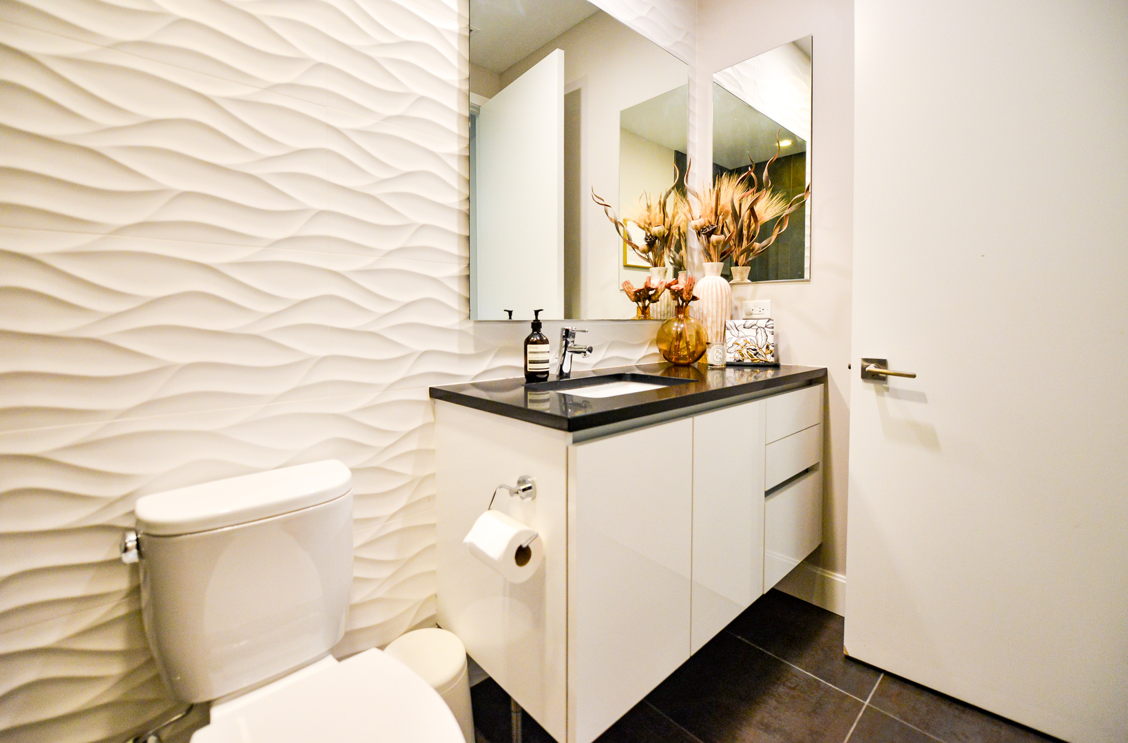 28 North Carpenter Street, Unit 2N Chicago, IL 60607 - Photo 27 of 30 a bathroom with a sink and a mirror