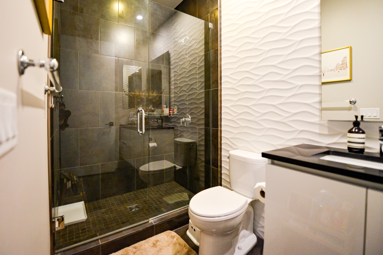 28 North Carpenter Street, Unit 2N Chicago, IL 60607 - Photo 28 of 30 a bathroom with a granite countertop sink toilet and shower