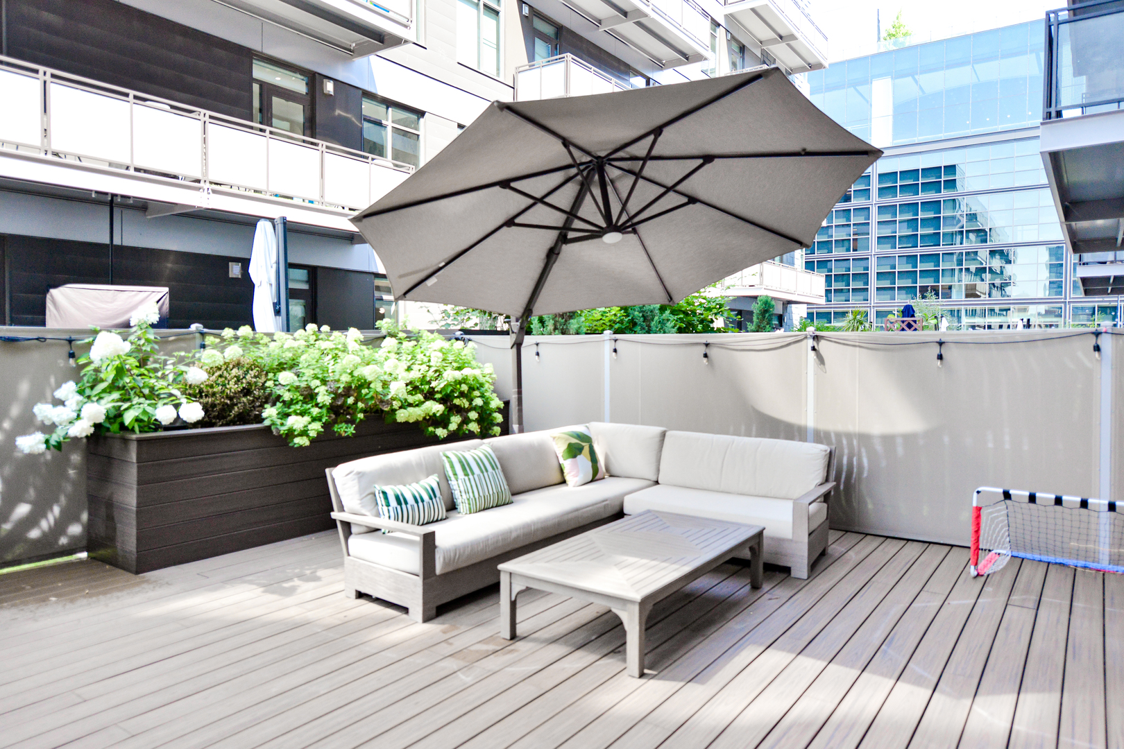 28 North Carpenter Street, Unit 2N Chicago, IL 60607 - Photo 29 of 30 a outdoor living space with furniture and an umbrella