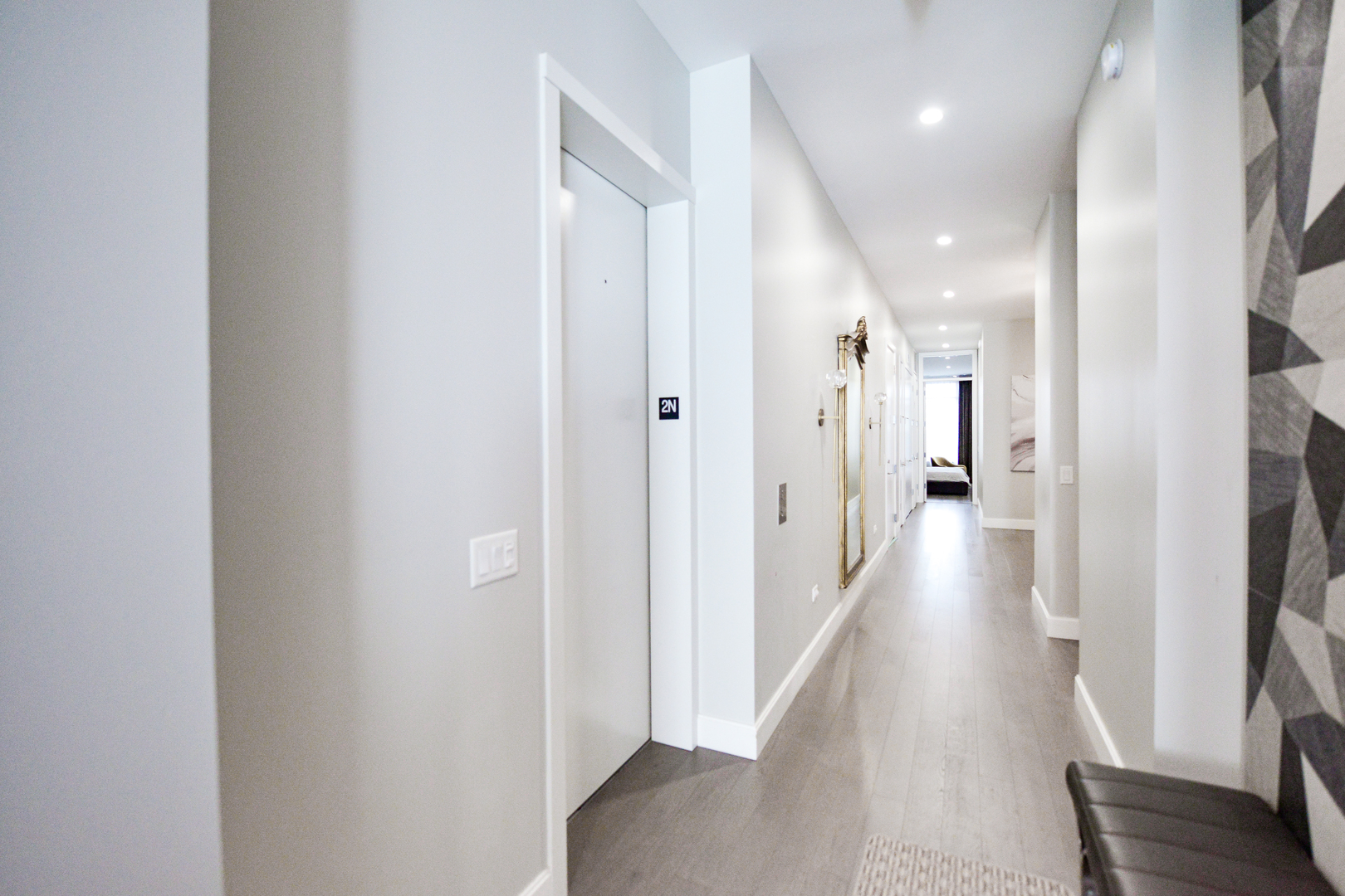 28 North Carpenter Street, Unit 2N Chicago, IL 60607 - Photo 10 of 30 a view of a hallway with wooden floor
