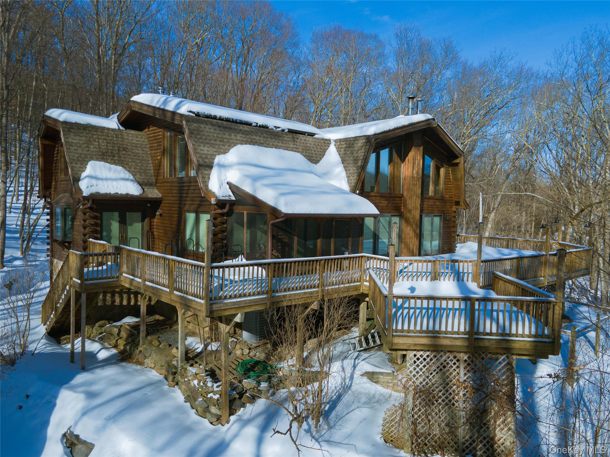 1644 Lakes Road Monroe, NY 10950 - Photo 1 of 49 a view of balcony with outdoor seating and wooden floor