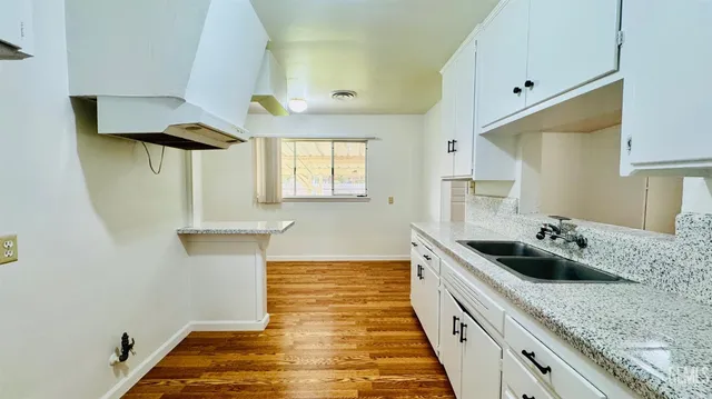 a kitchen with a sink and cabinets
